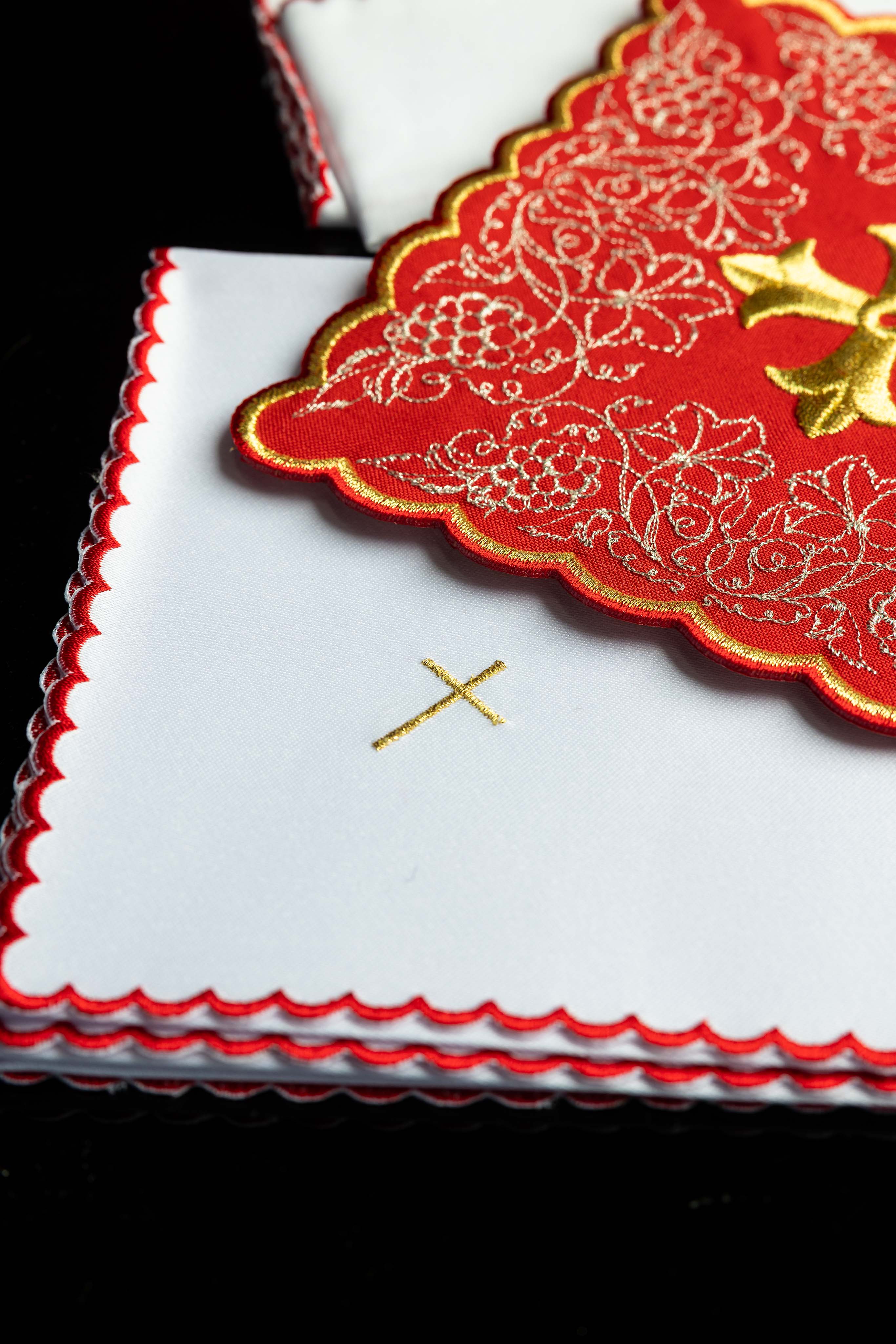 Red embroidered chalice linens set with a cross motif