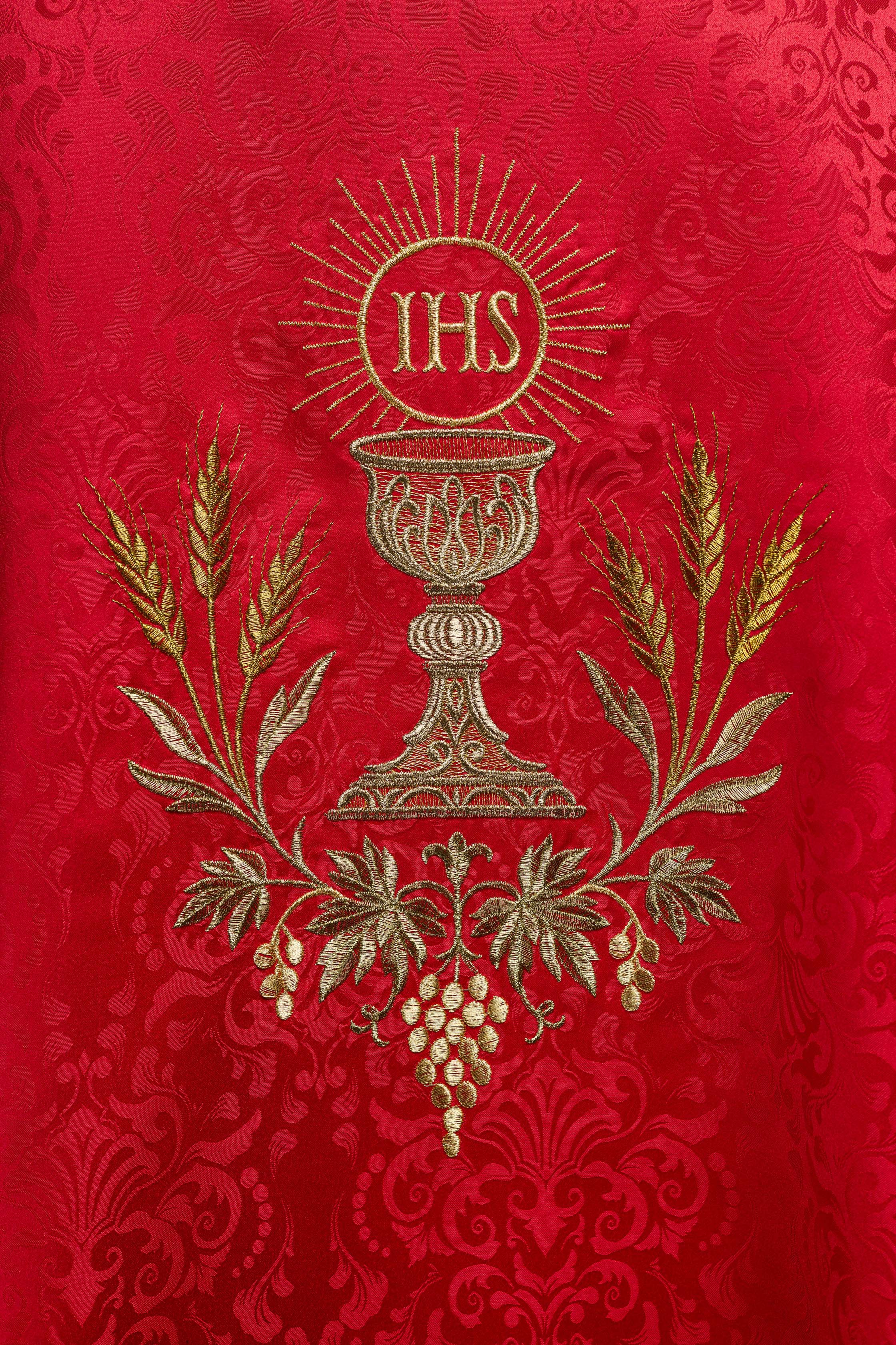 Red liturgical chasuble with embroidered chalice and host on jacquard fabric