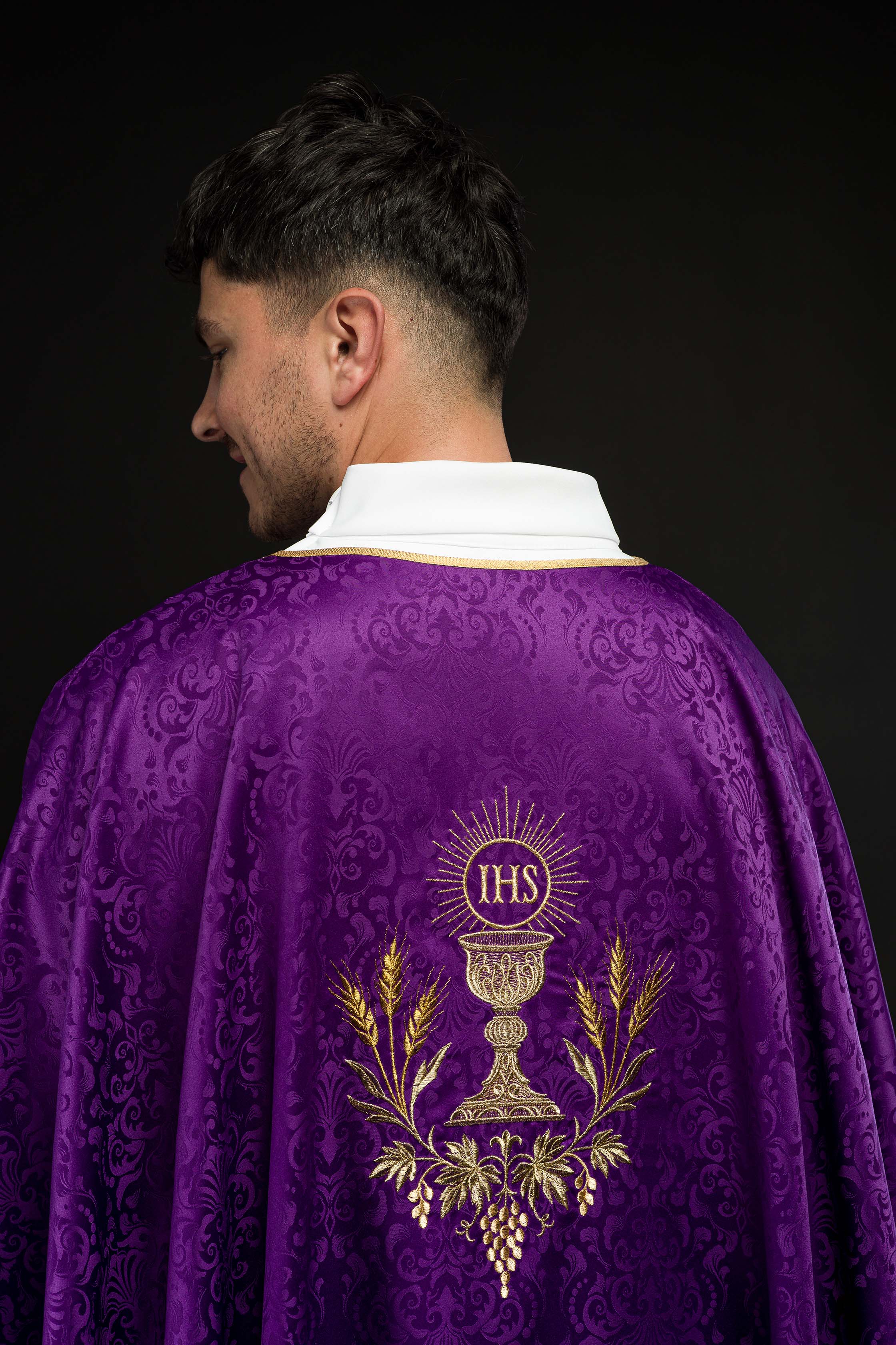 Purple liturgical chasuble with embroidered chalice and host on jacquard fabric