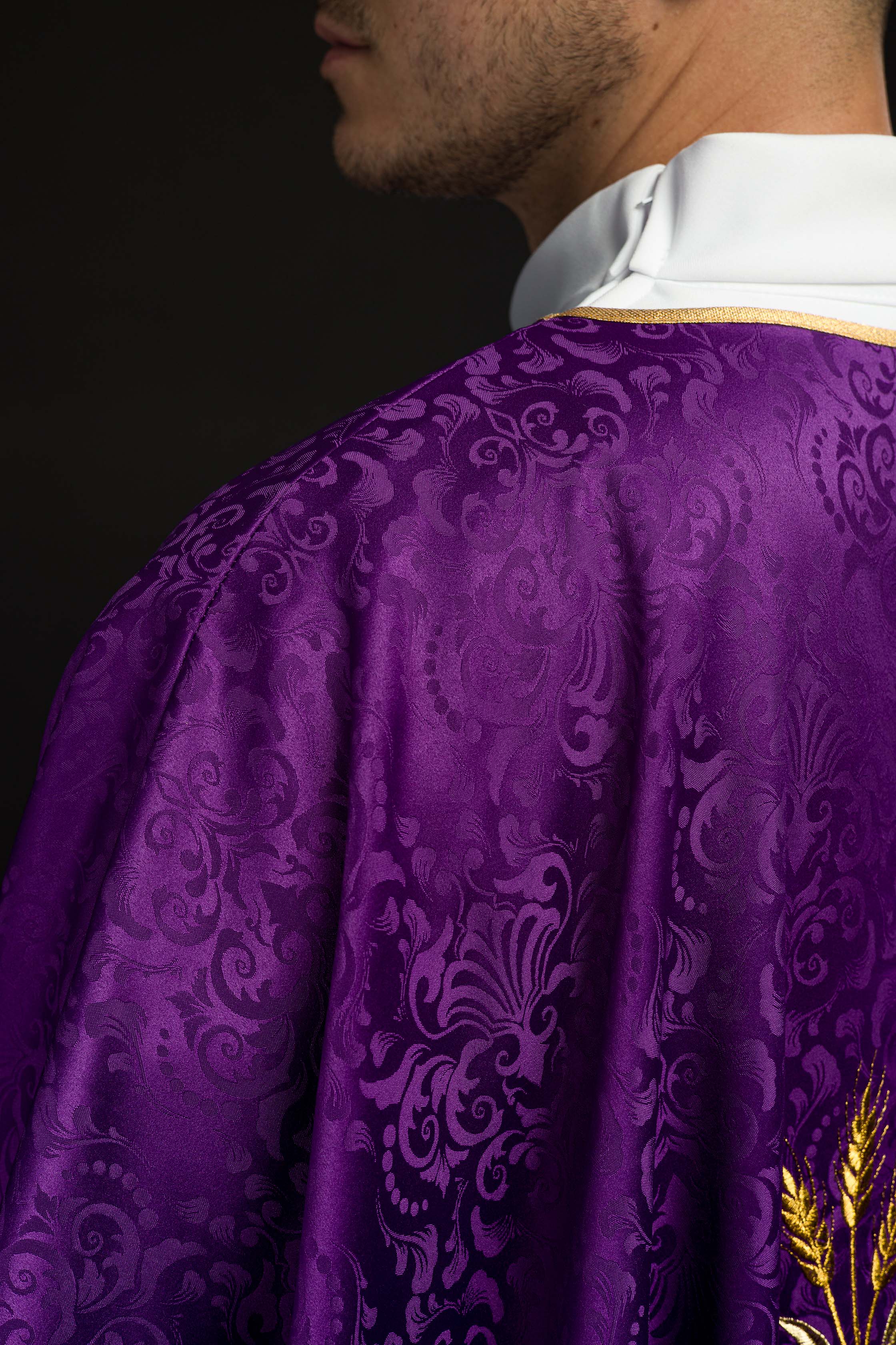 Purple liturgical chasuble with embroidered chalice and host on jacquard fabric