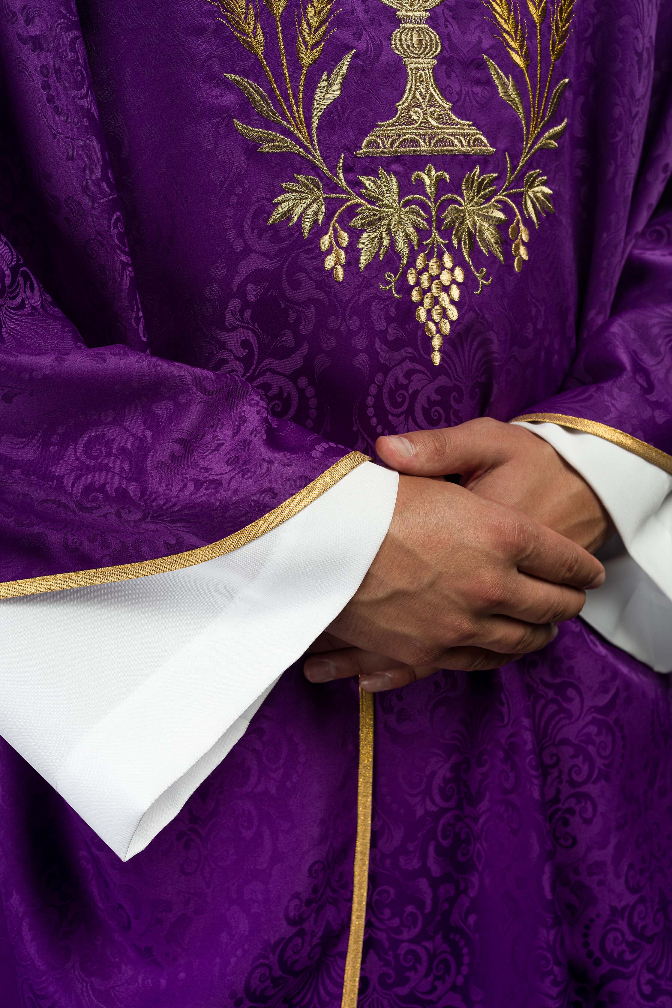 Purple liturgical chasuble with embroidered chalice and host on jacquard fabric