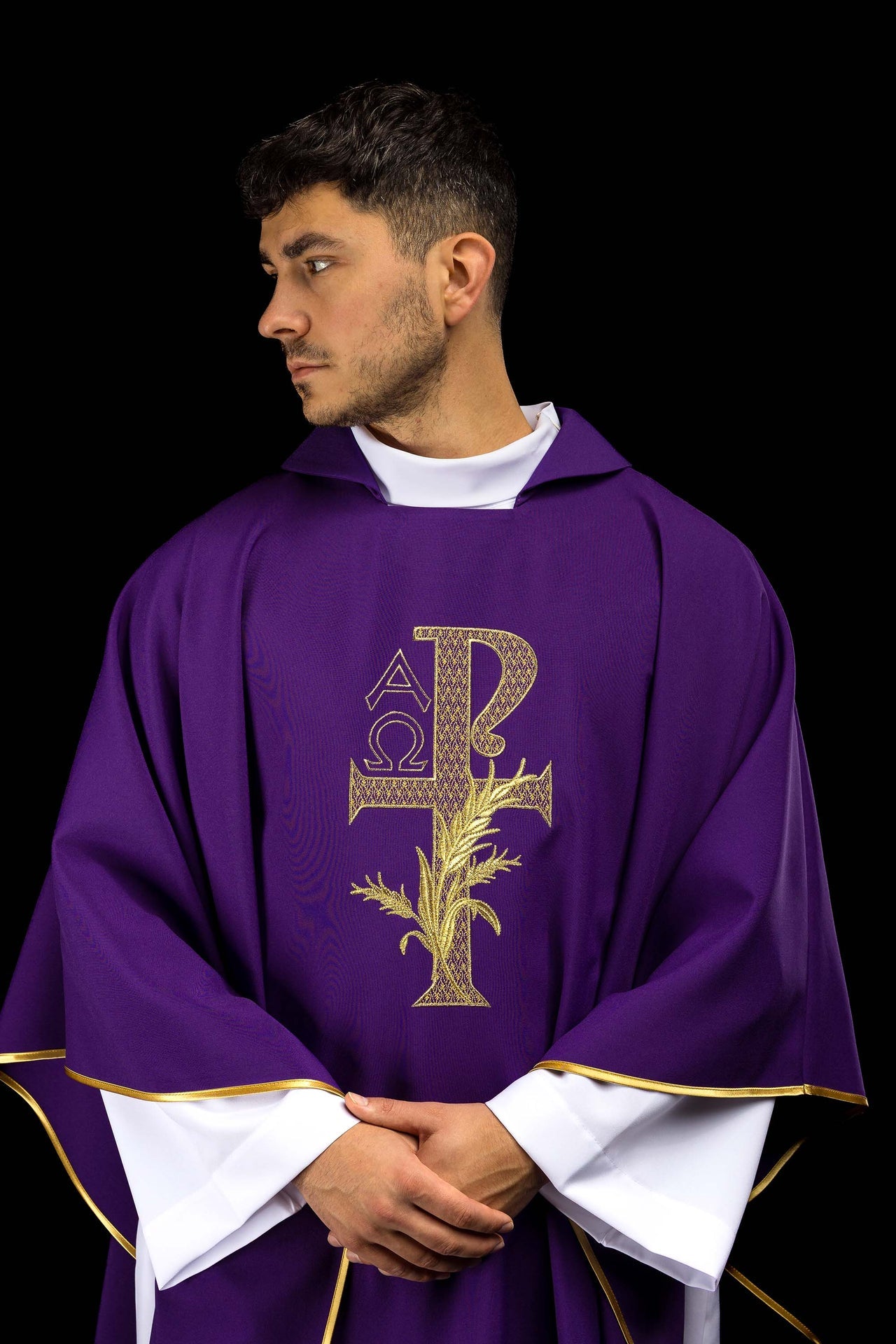 Purple embroidered chasuble with Alpha and Omega symbol and wide collar