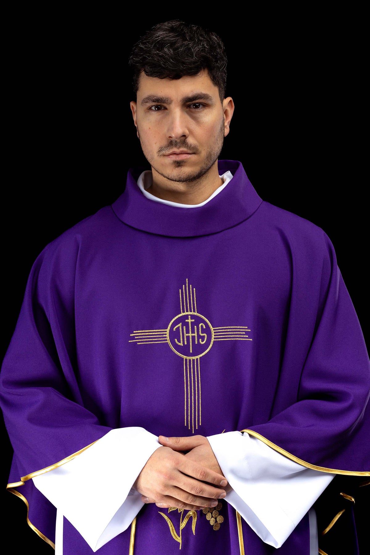 Purple chasuble embroidered with IHS motif