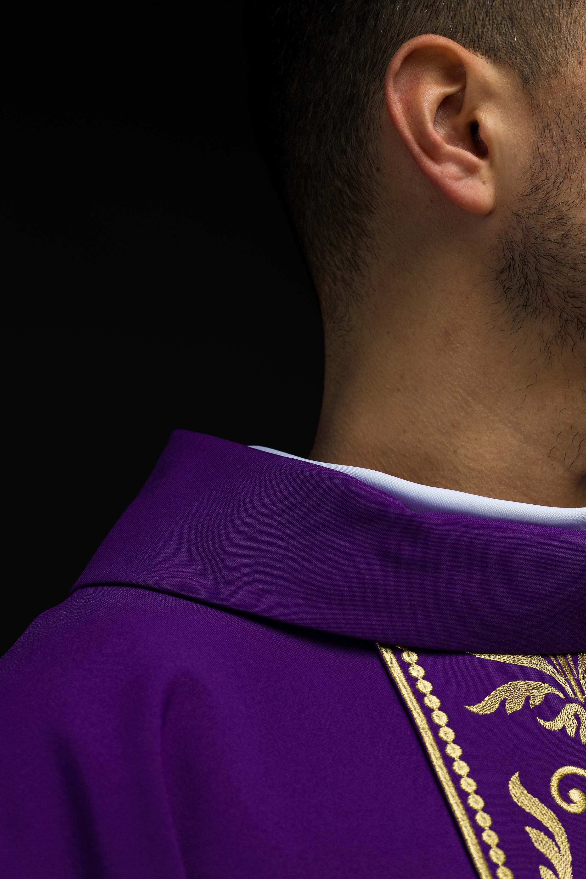 Purple liturgical chasuble decorated with a gold embroidered belt