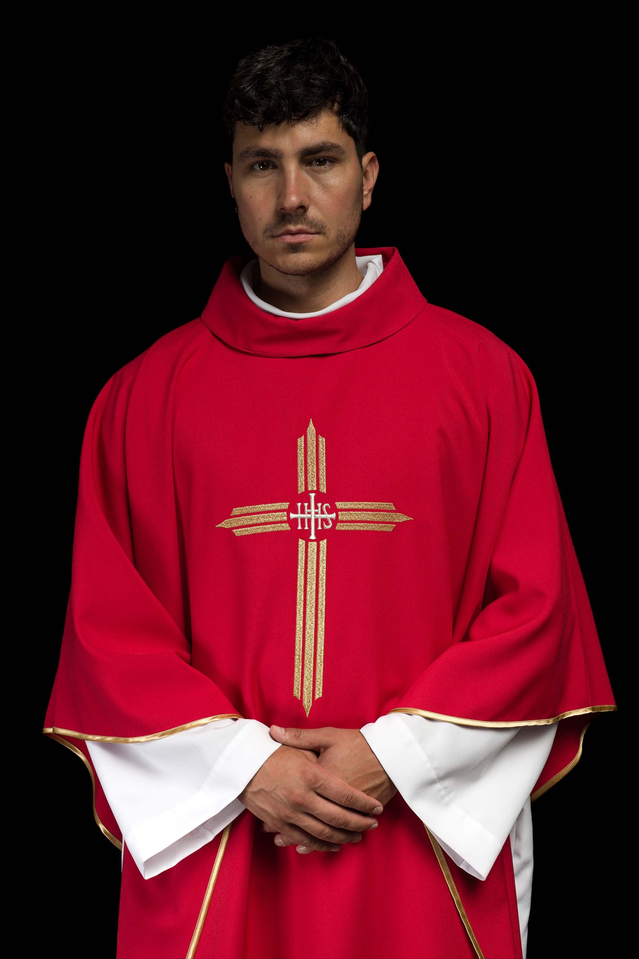 Red chasuble embroidered with the symbol of Cross IHS