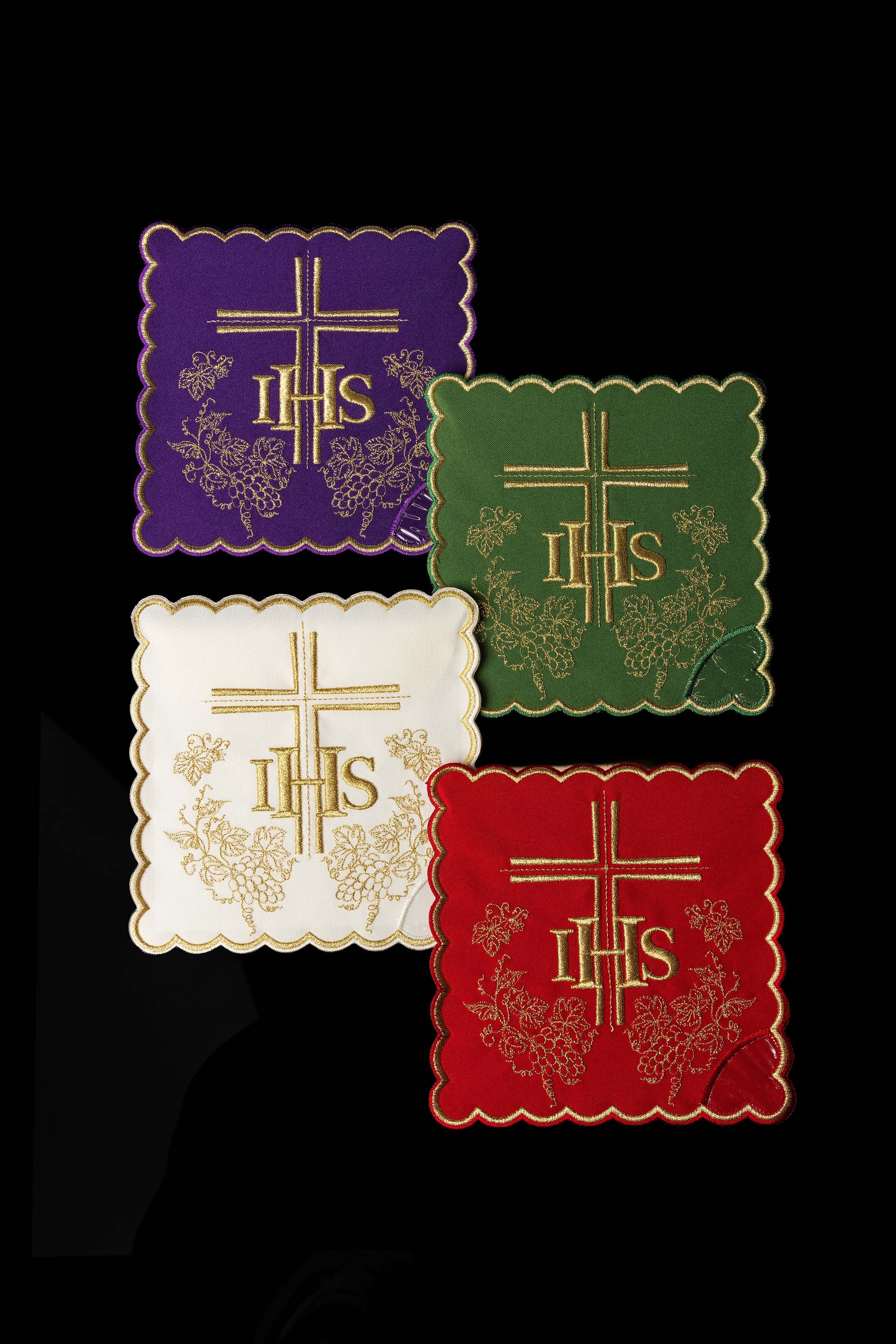 Set of chalice palls with the IHS symbol in four liturgical colors
