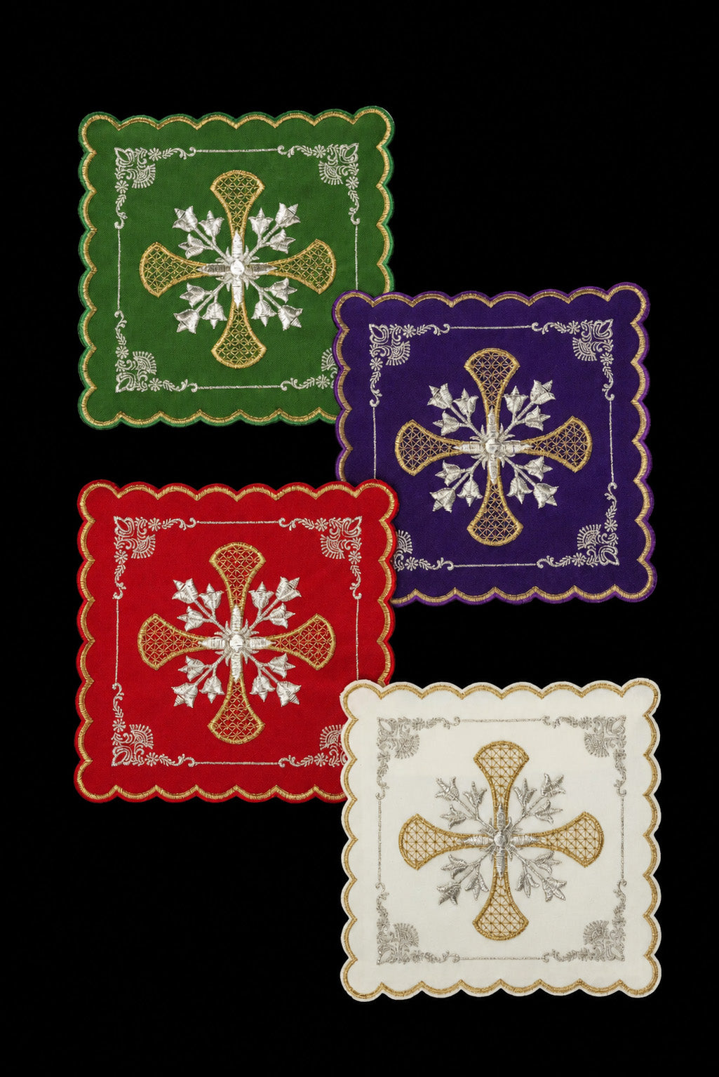 Set of chalice palls with a cross symbol in four liturgical colors
