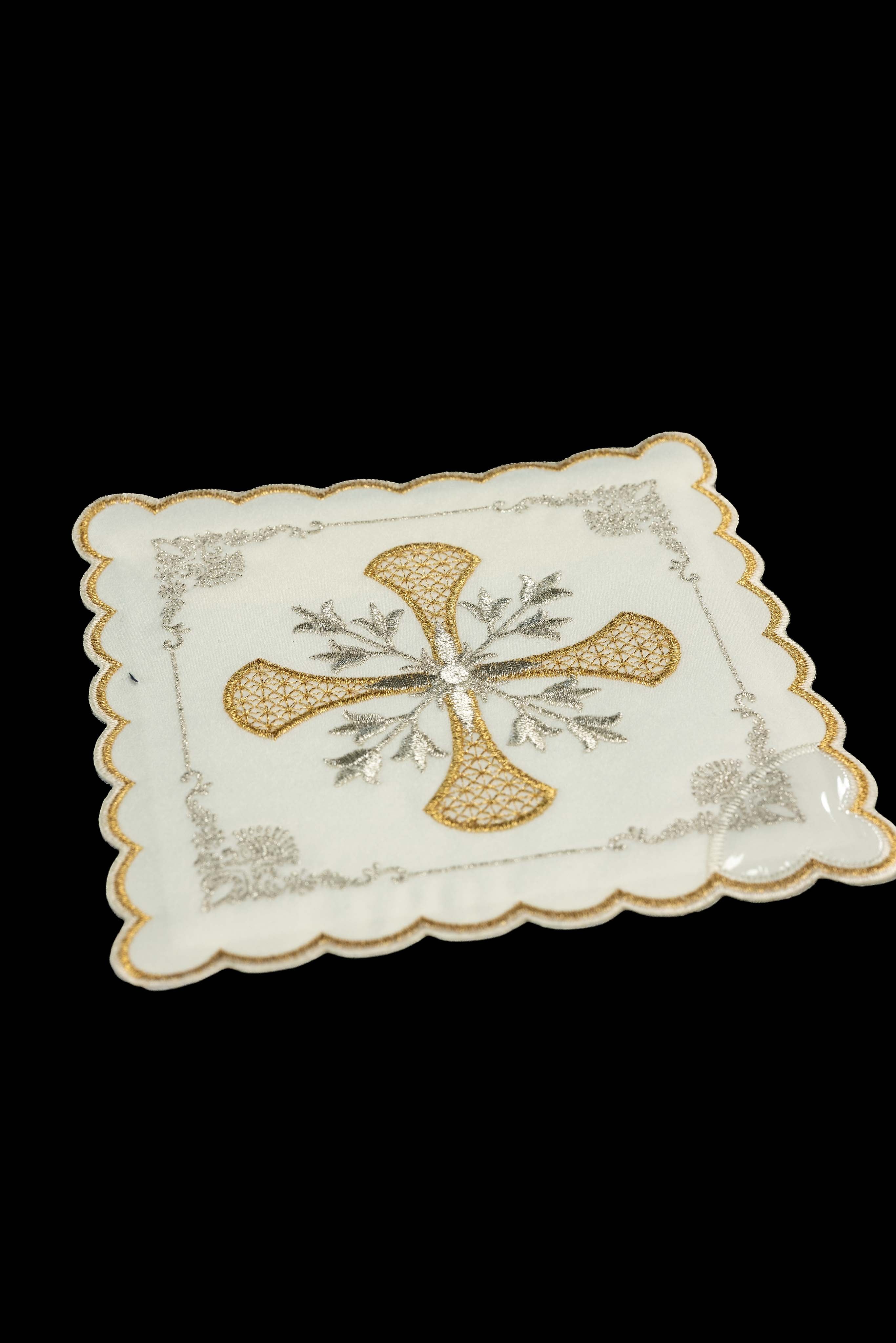 Set of chalice palls with a cross symbol in four liturgical colors