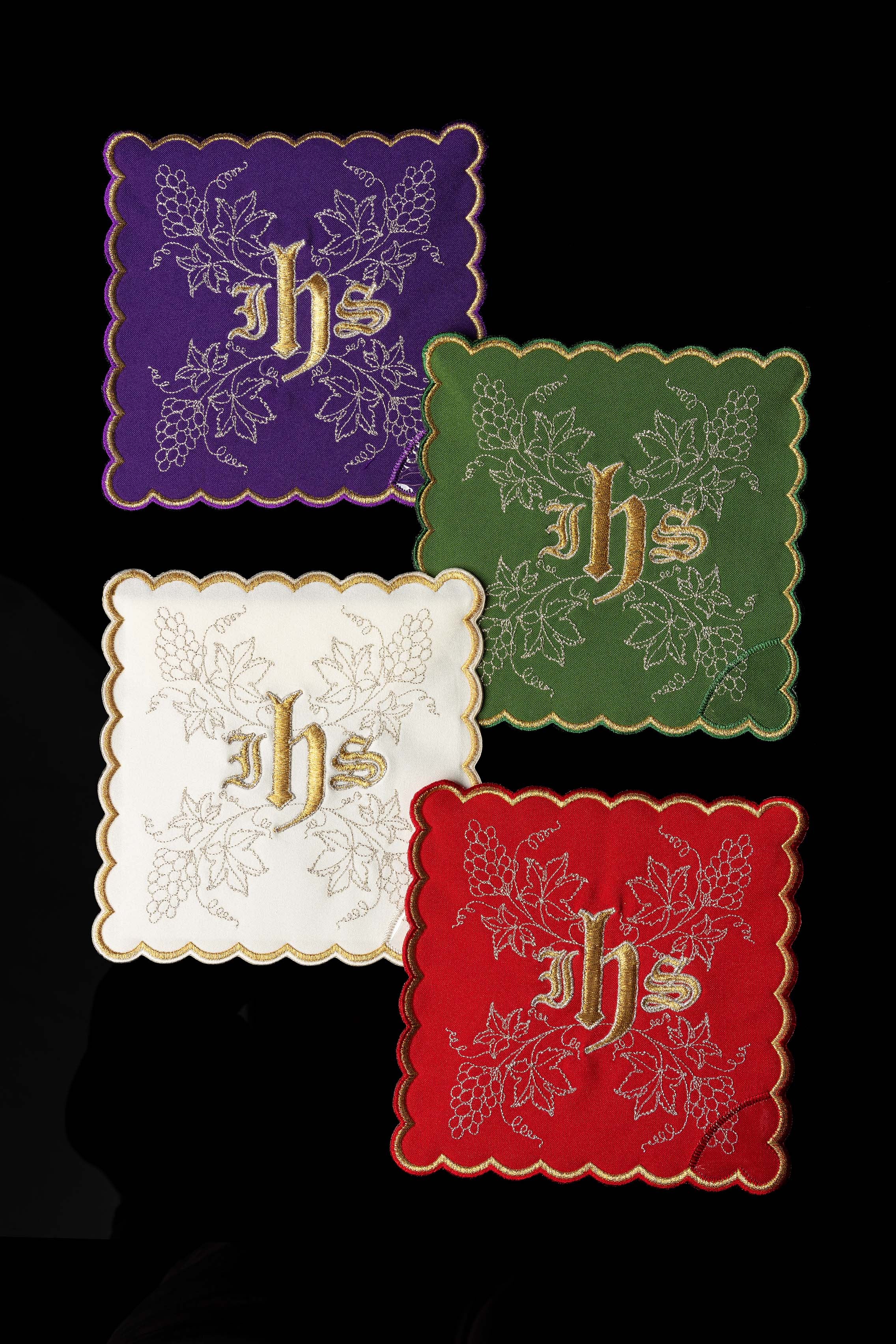Set of chalice palls with the IHS symbol in four liturgical colors
