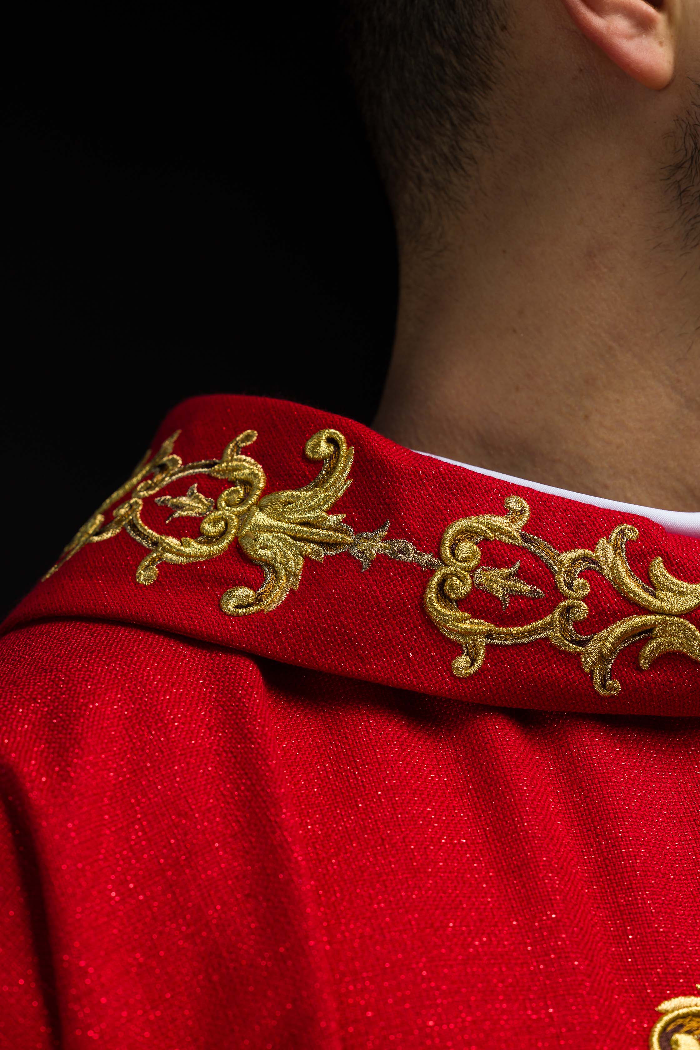 Red chasuble richly embroidered with gemstones