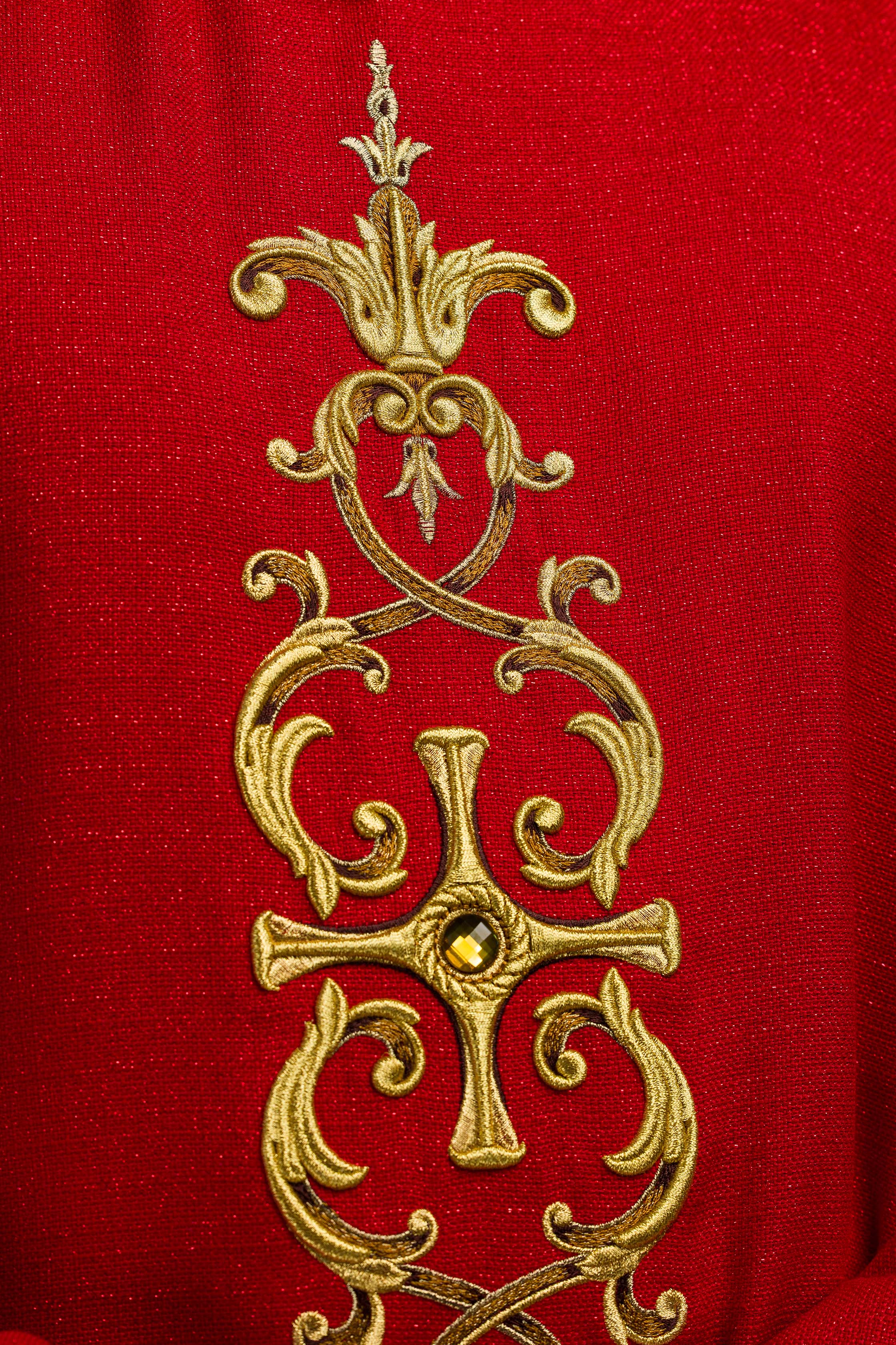 Red chasuble richly embroidered with gemstones