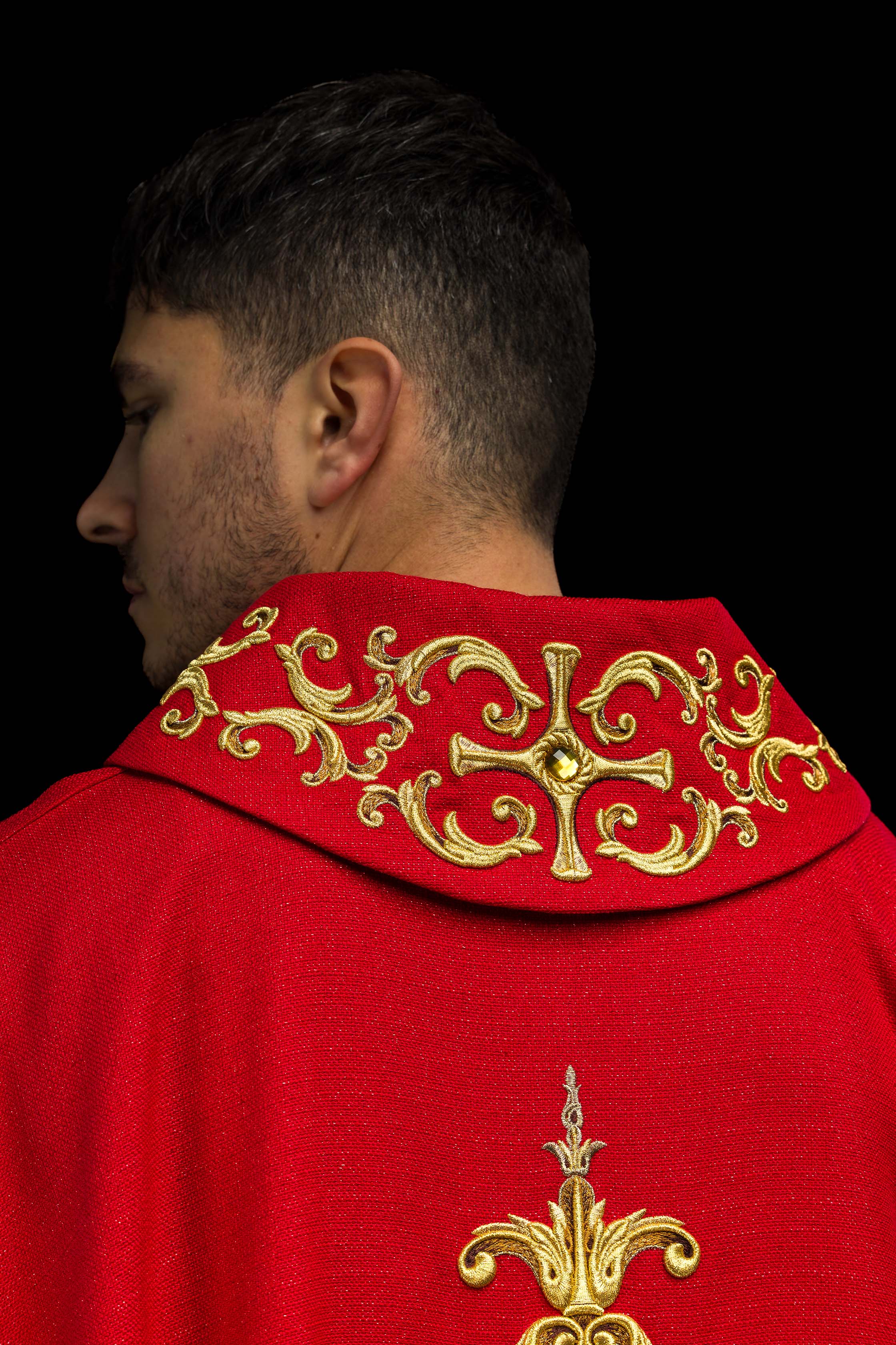 Red chasuble richly embroidered with gemstones