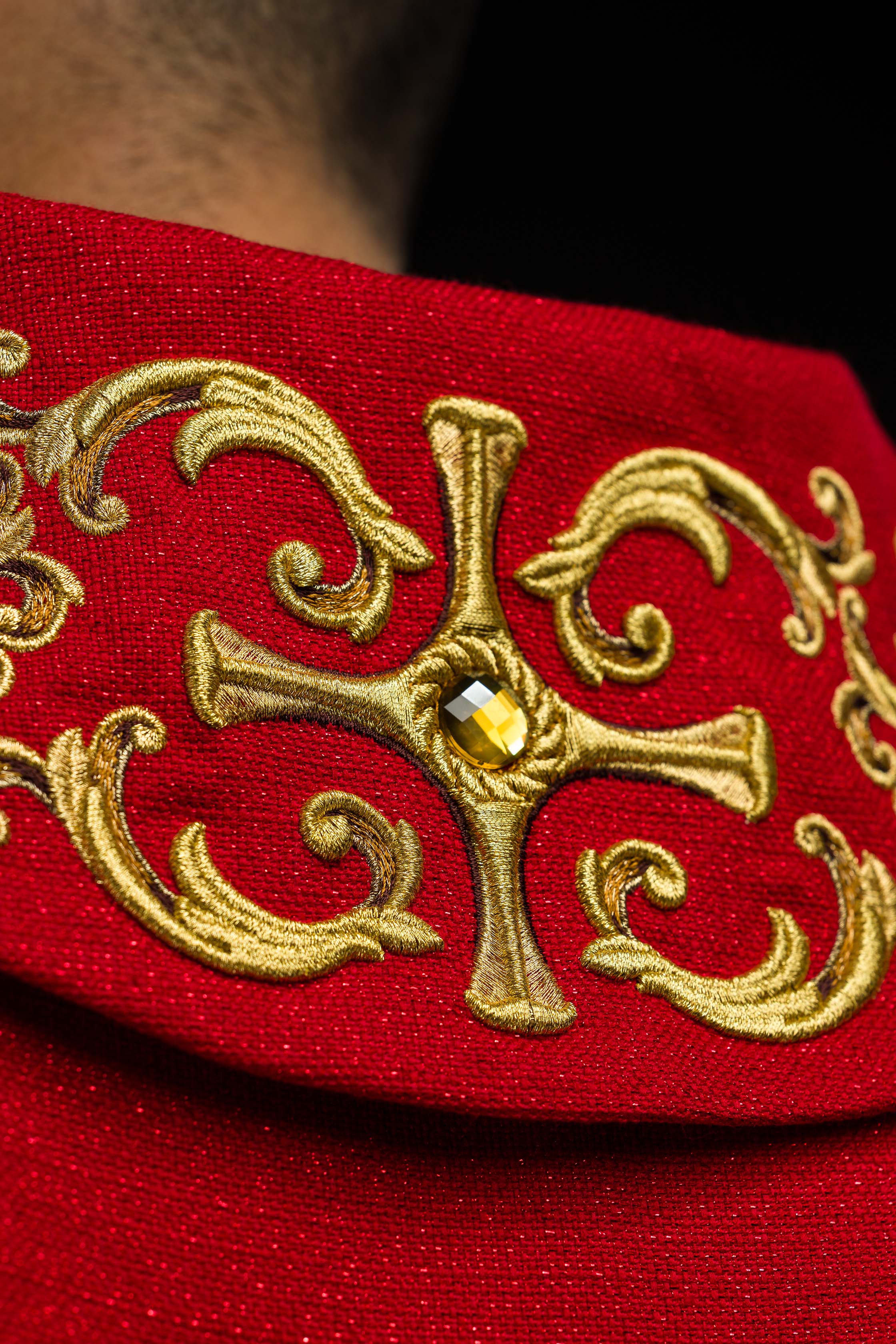 Red chasuble richly embroidered with gemstones