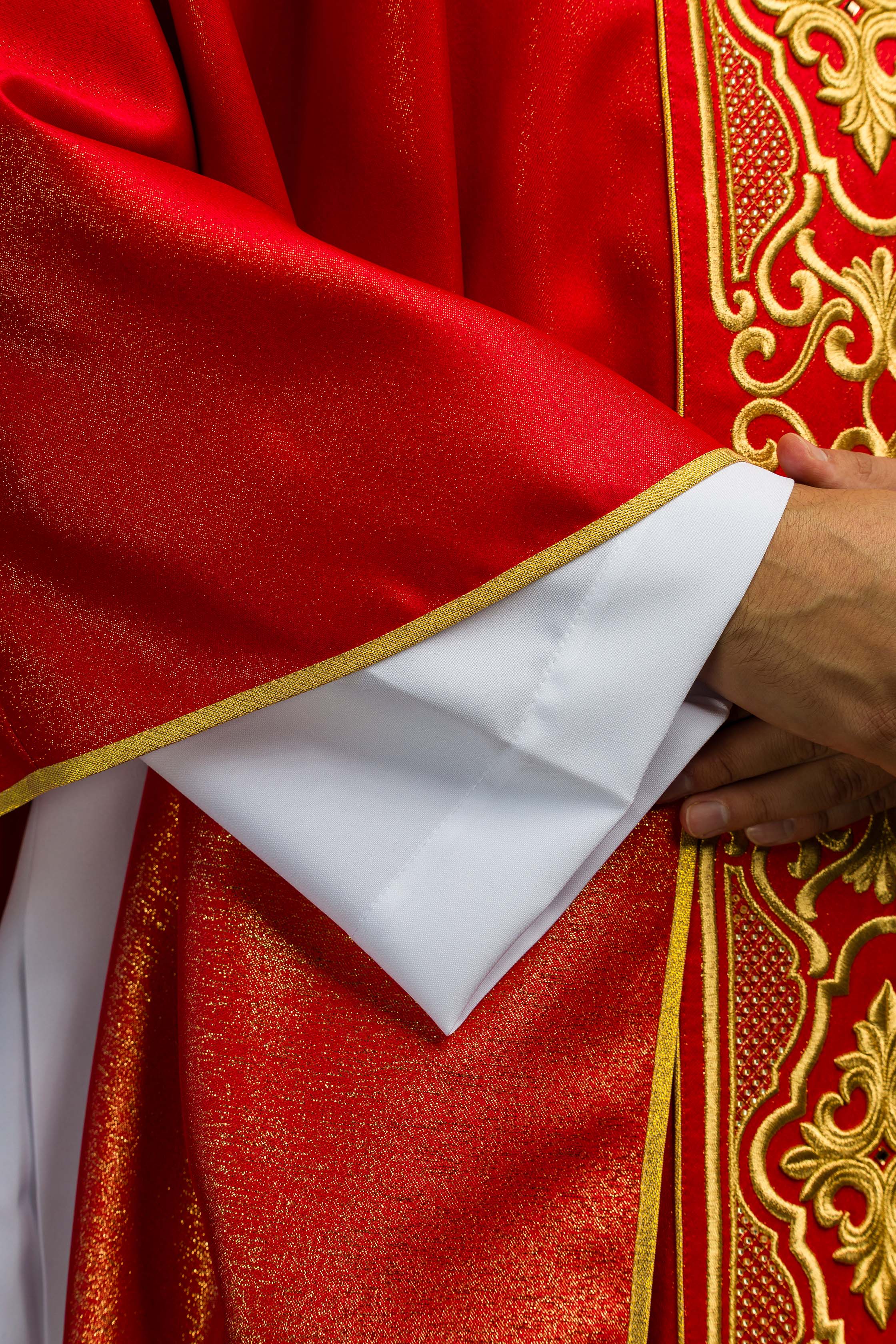 Red chasuble on shiny fabric