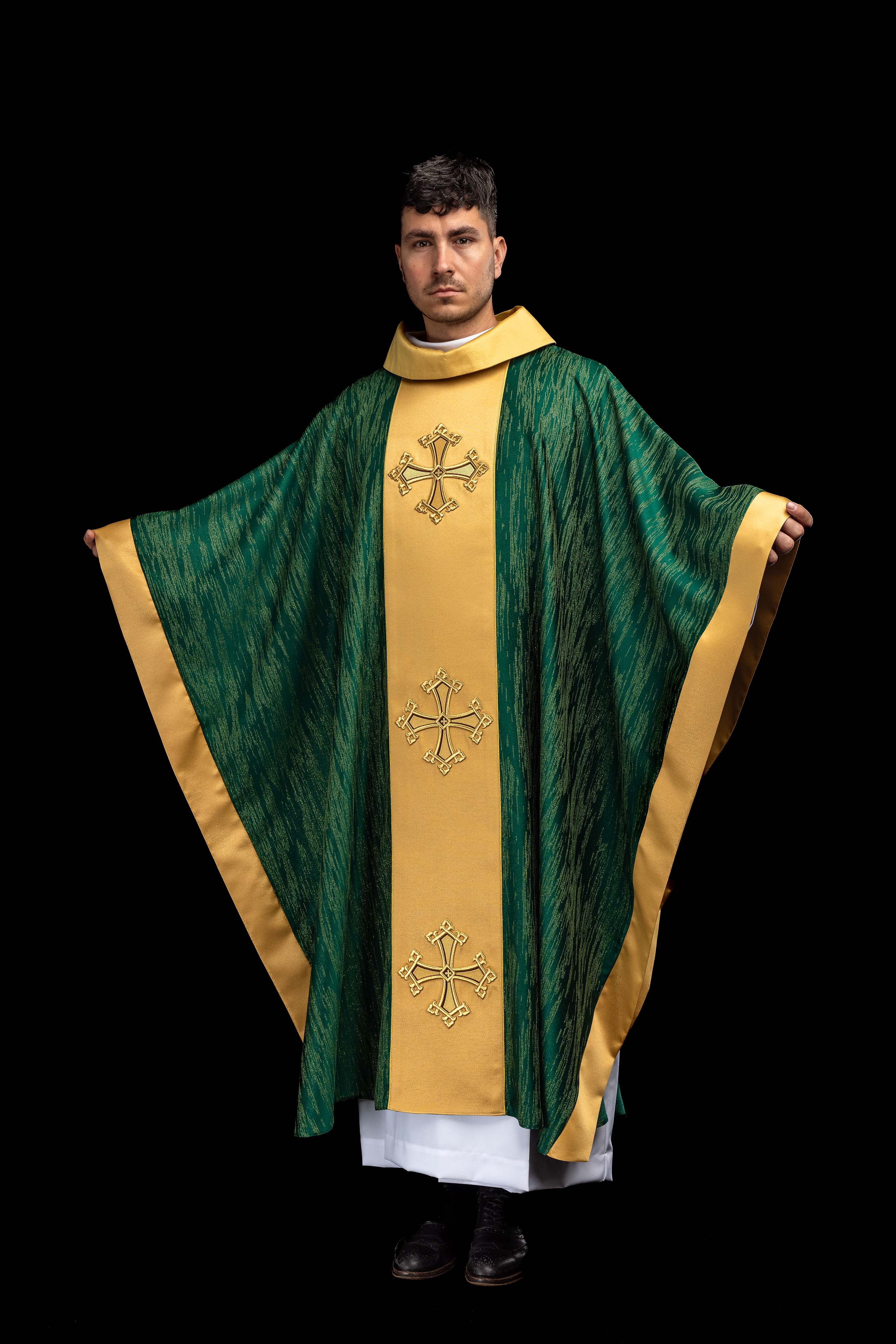 Green chasuble with an embroidered cross motif featuring a panel on decorative fabric