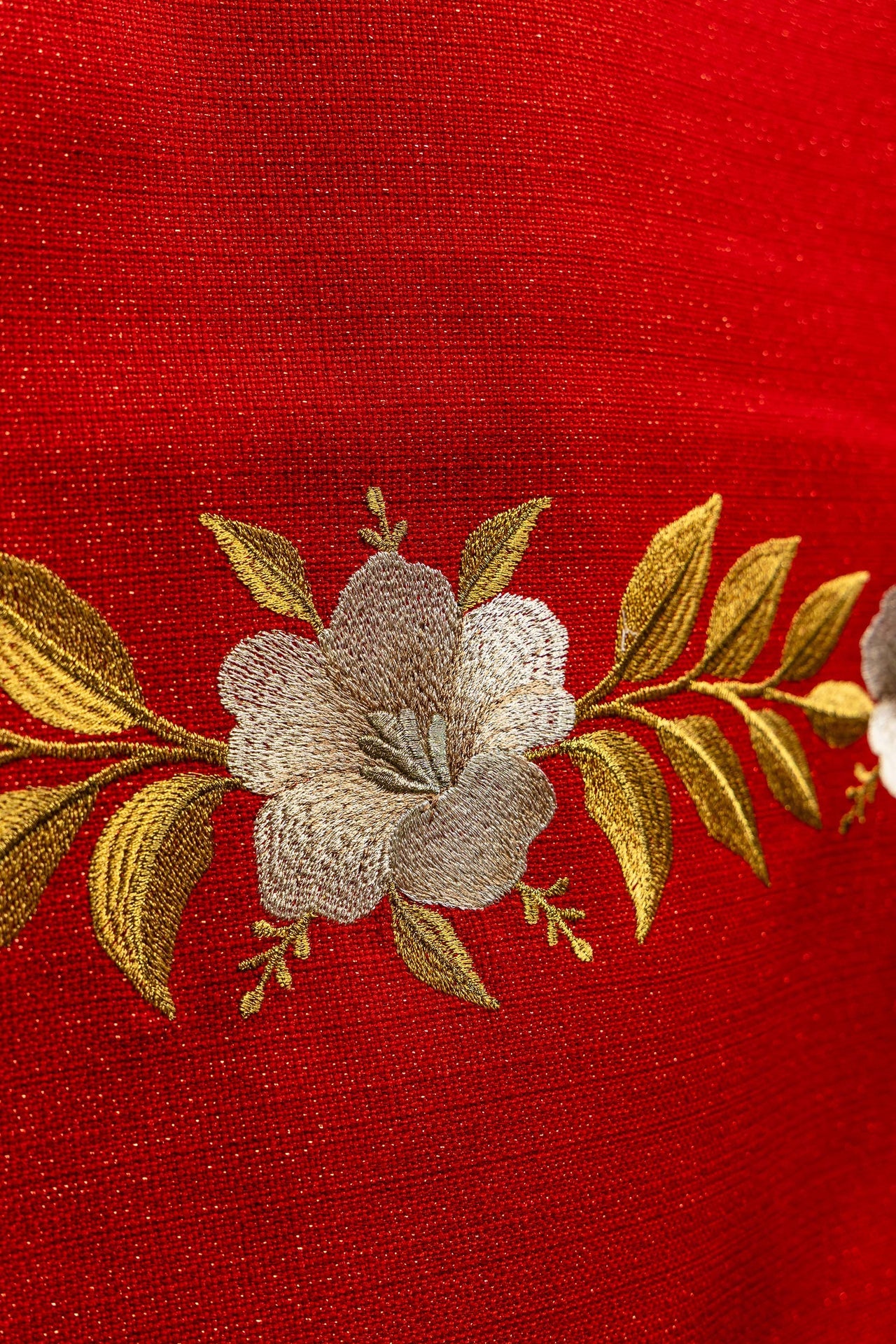 Red embroidered lectern cloth with the symbol of the dove and flames