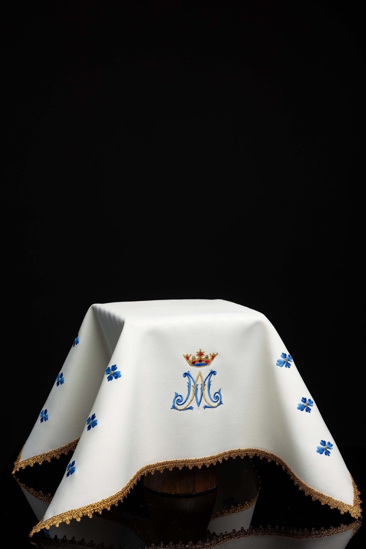 Front view of a white Chalice Veil with Marian Embroidery, blue flowers and gold trim