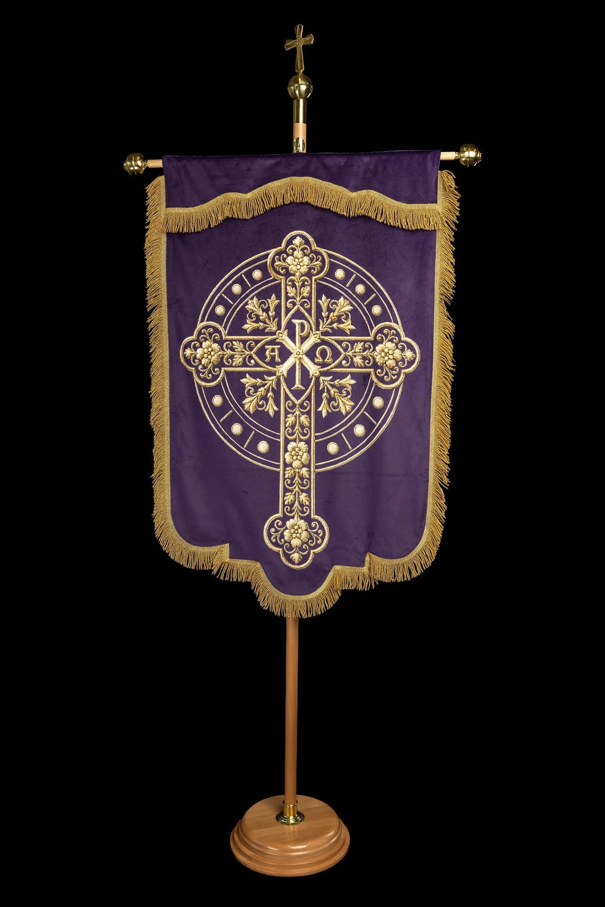 Back view of the purple banner with a gold cross and Alpha Omega motif