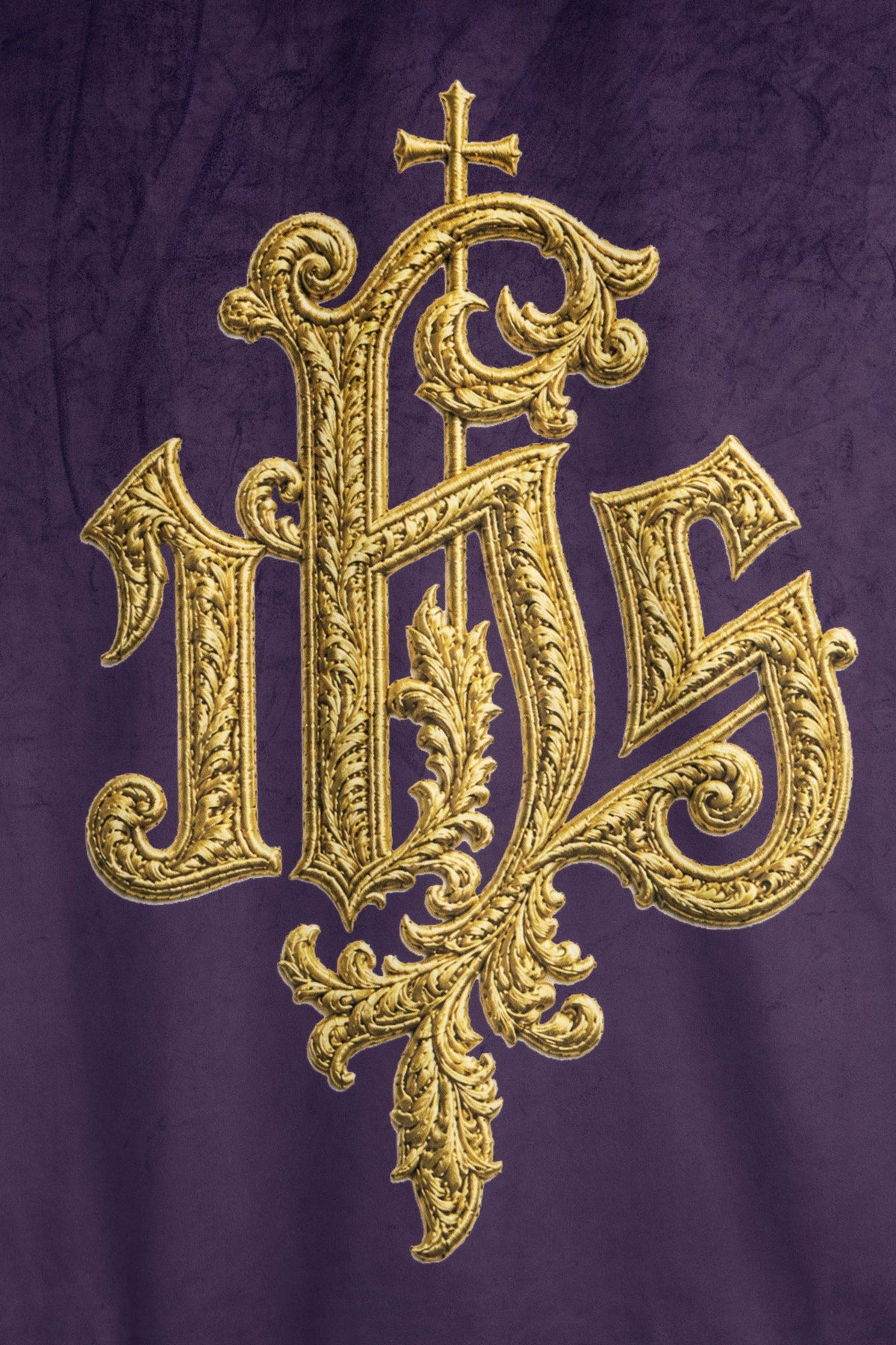 Close-up of the purple banner with ornate gold IHS motif