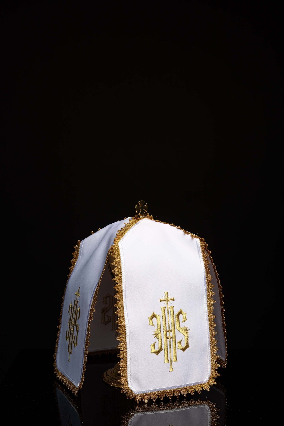 Front view of a Ciborium Veil with Gold IHS Embroidery in white with gold trim