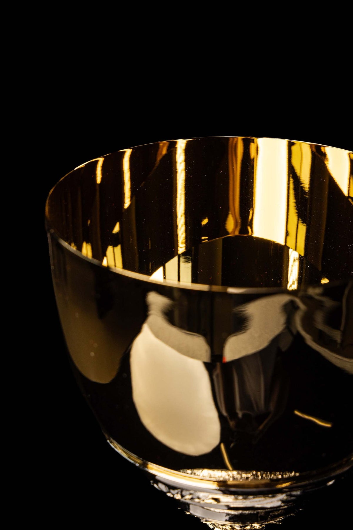 Close-up of the gold-plated chalice cup with a smooth reflective finish