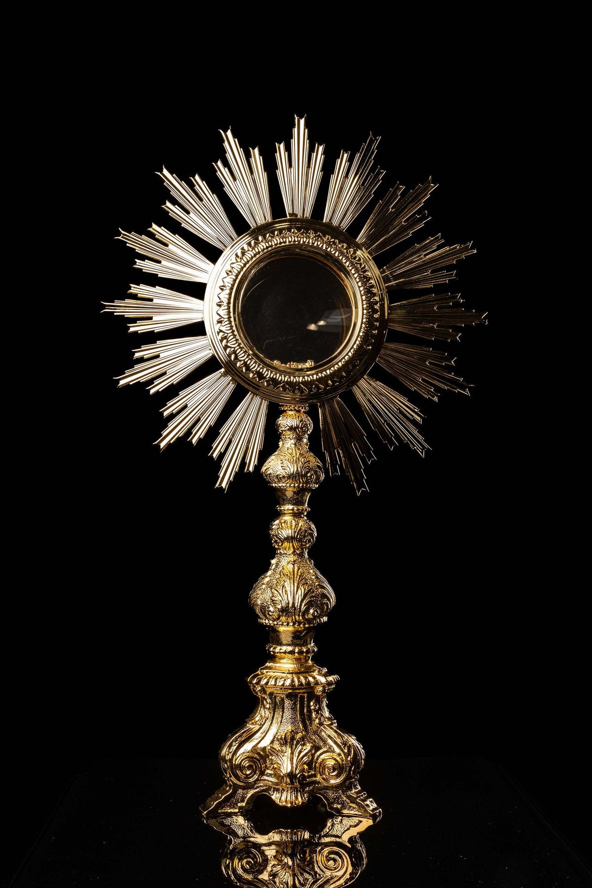 Front view of a Monstrance Ornamented with Gold-Plated Baroque Details, 30.5 in (77 cm), with radiant rays and ornate base