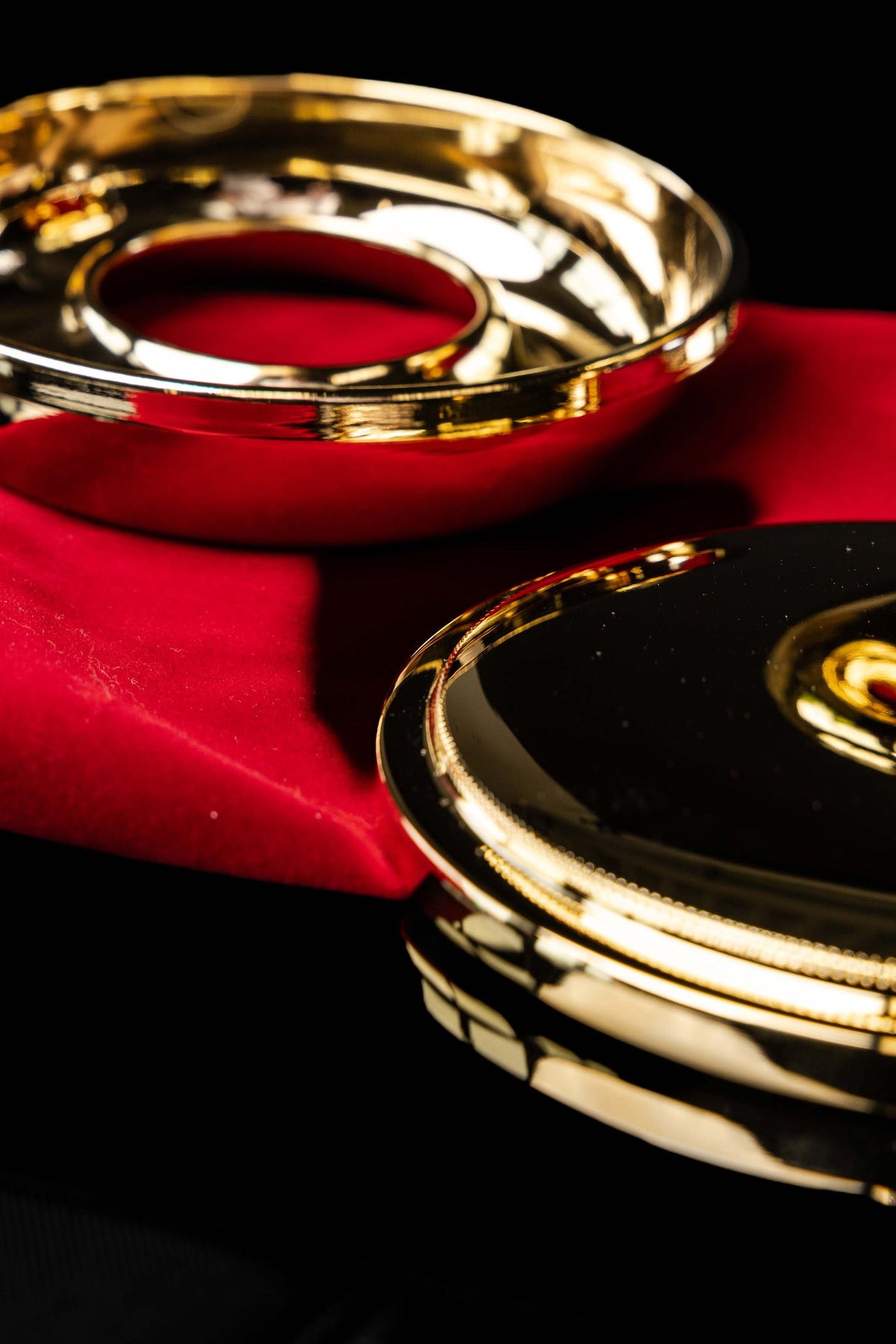 Ciborium with decorative cross shown beside its red protective case