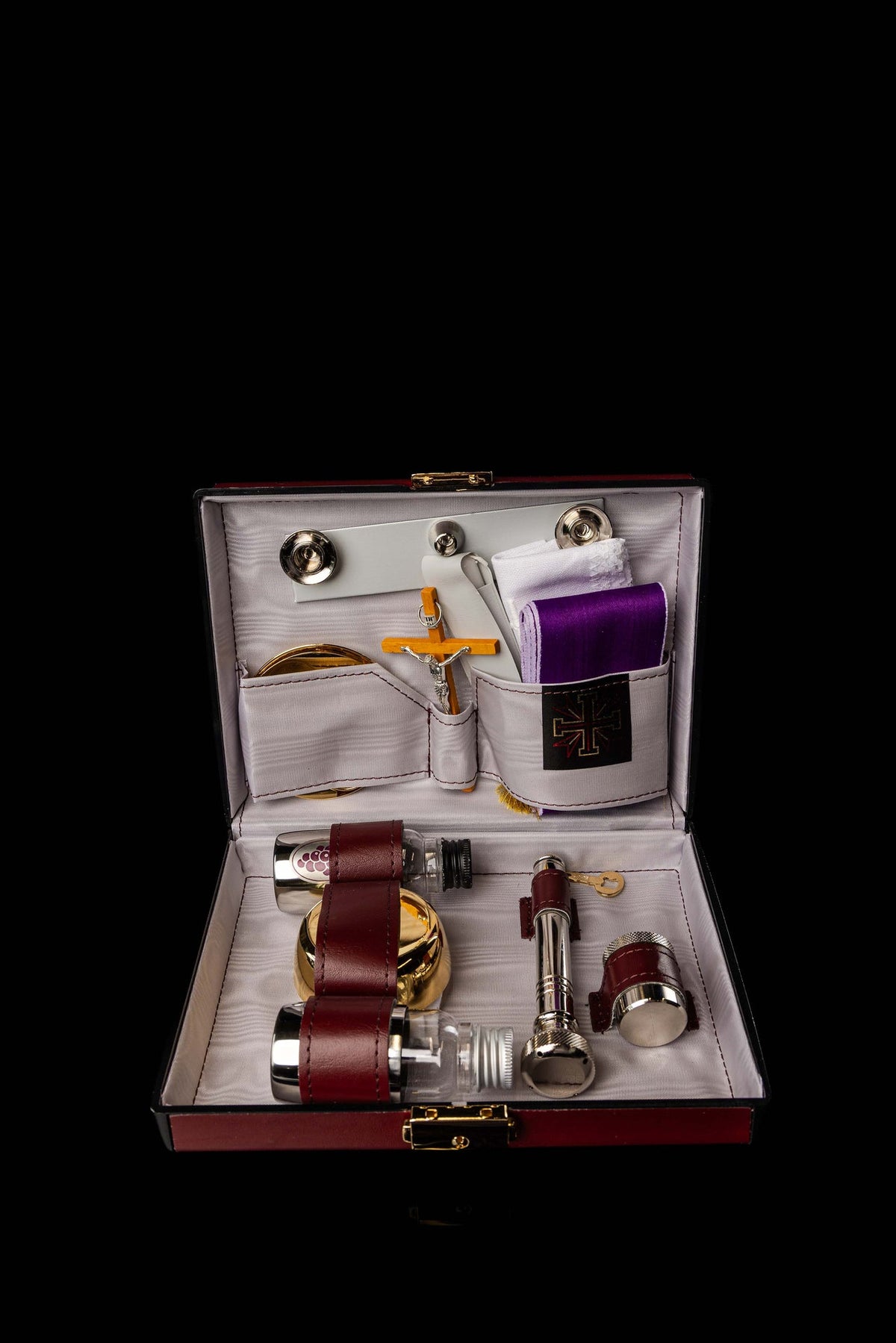 Open Liturgical Equipment Suitcase Built with a Hard Shell with organized liturgical items