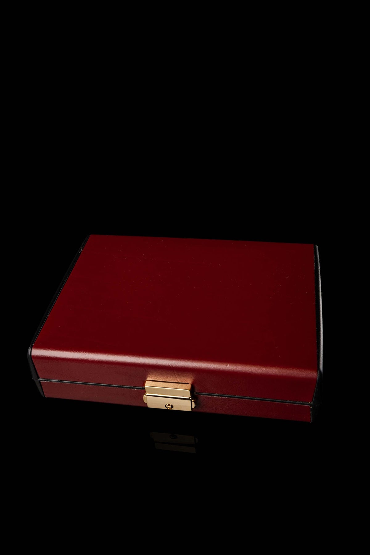 Front view of Liturgical Equipment Suitcase Built with a Hard Shell in burgundy with gold clasp