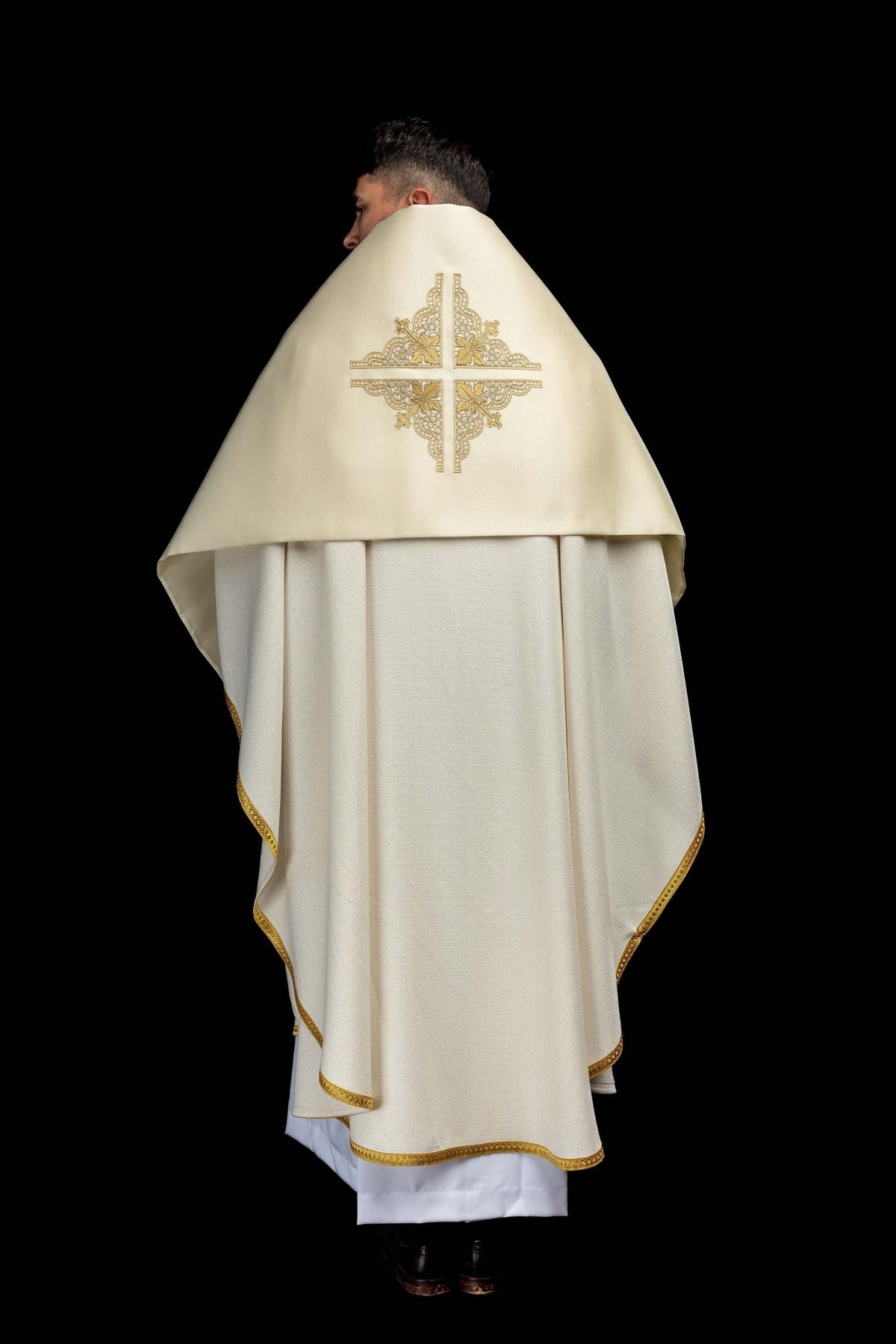 Back view of the ecru humeral veil with embroidered cross and gold-trimmed edges