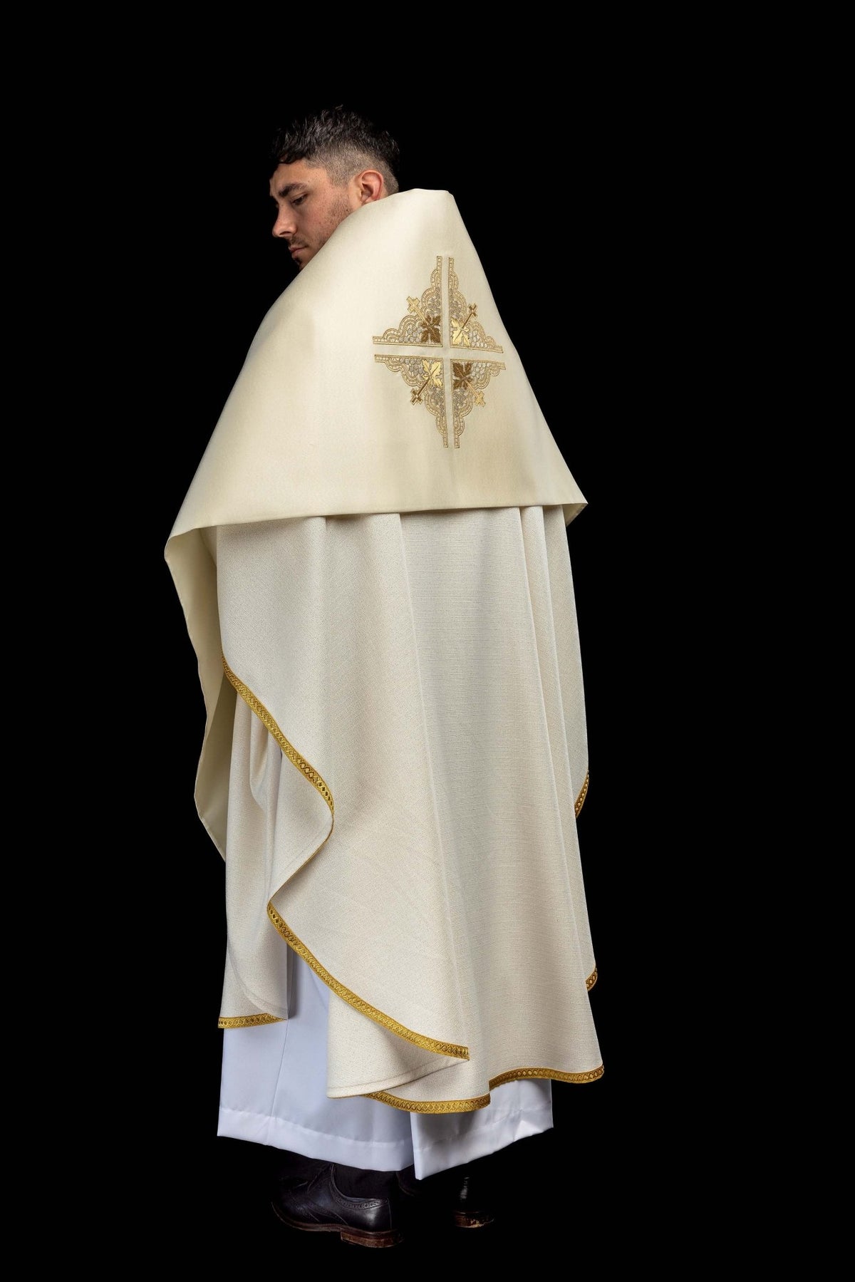 Side back view of the humeral veil showing the embroidered cross and gold trim