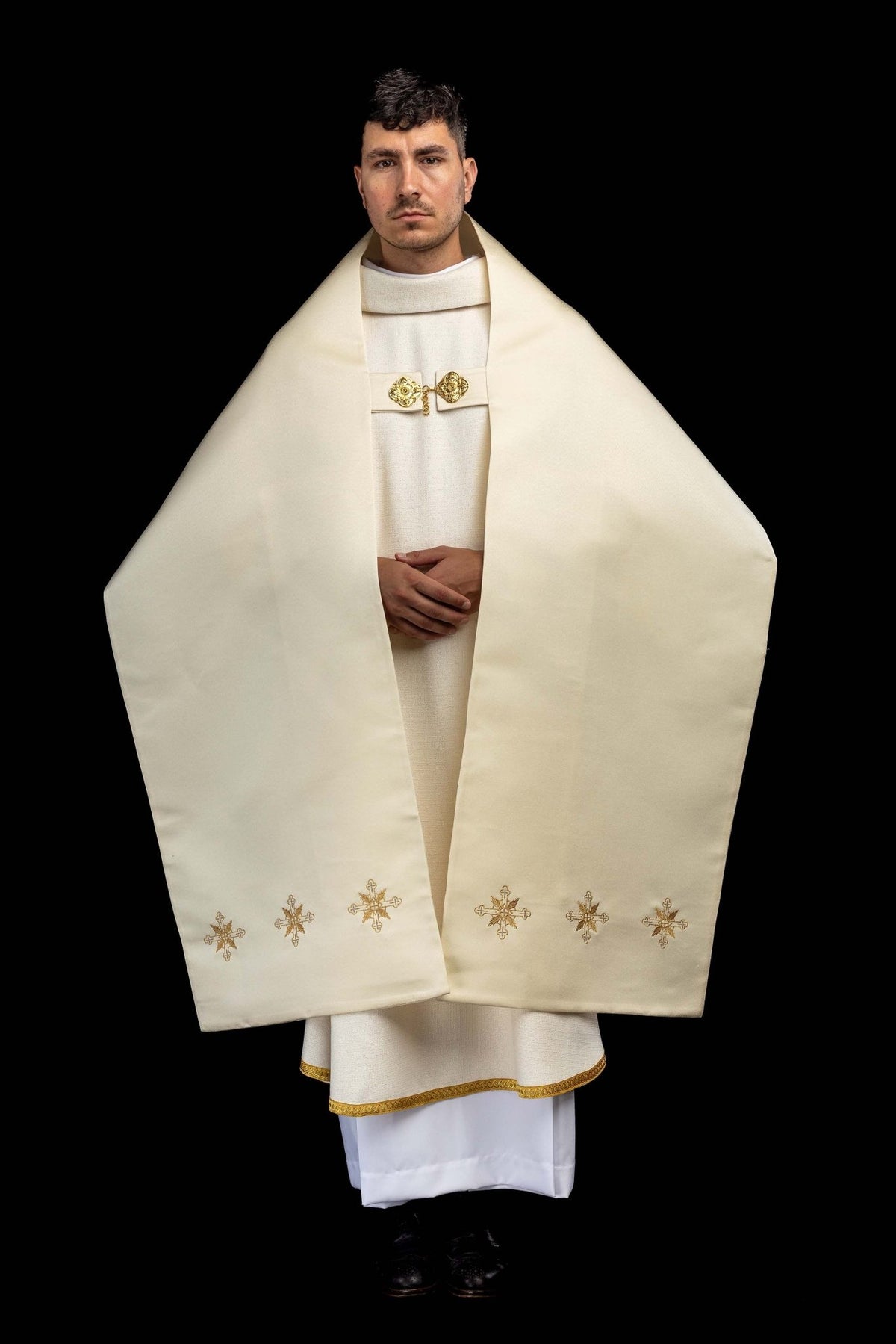 Full front view of the ecru humeral veil showing cross motifs and gold edging