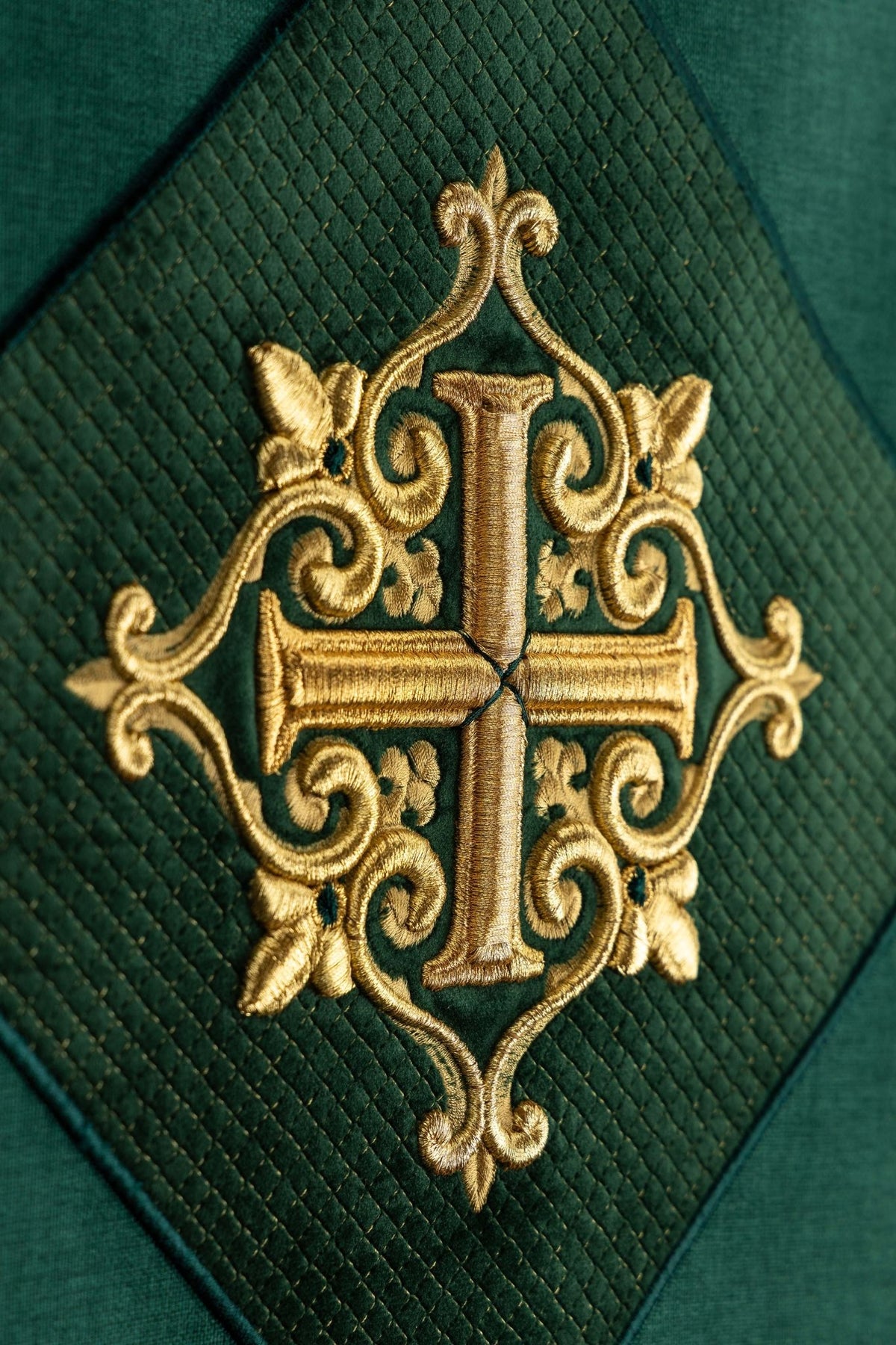Close-up of the lectern cloth showing its gold embroidered cross motif