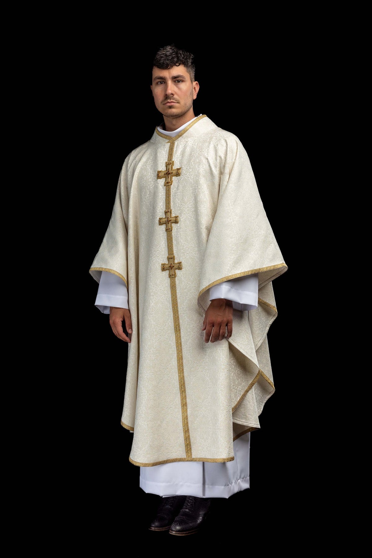 Front view of a handmade chasuble with embroidered 3D crosses and natural stones in ivory and gold