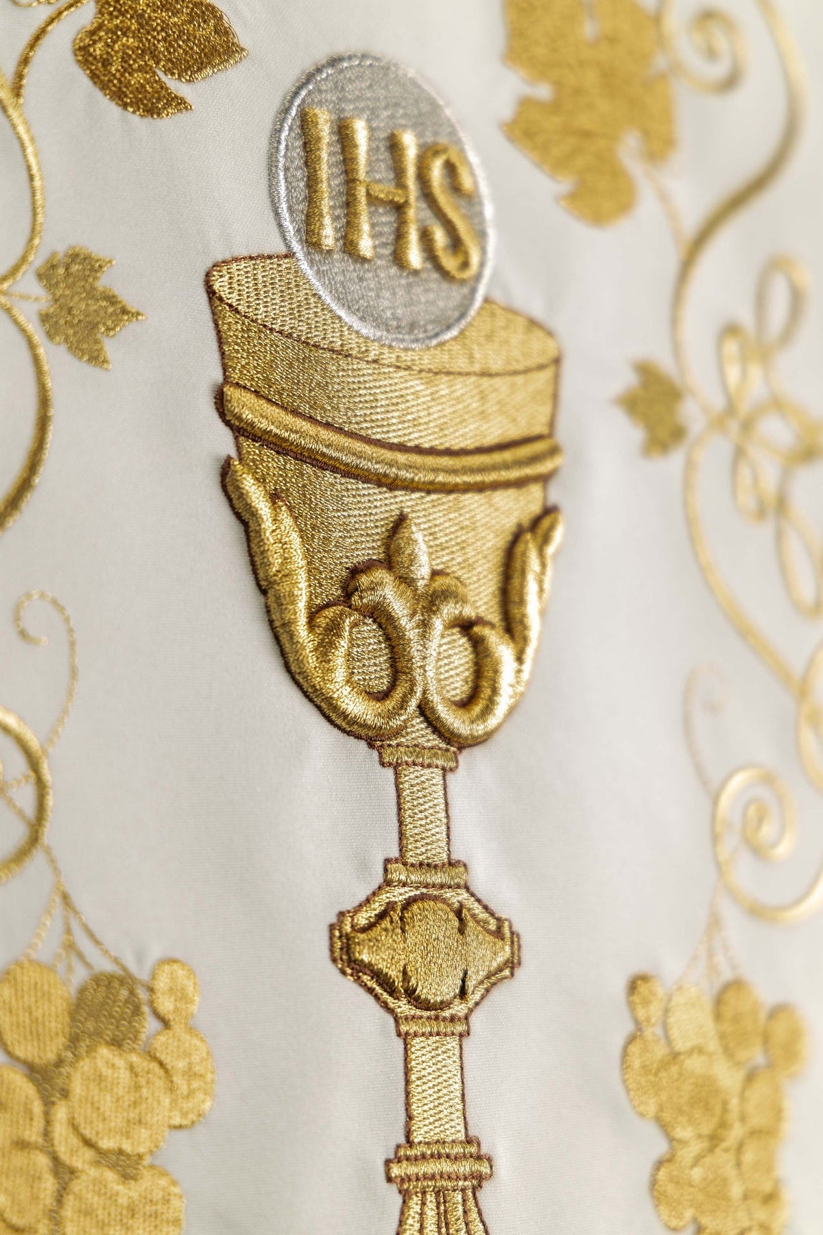 Close-up of the embroidered chalice on an ecru church lectern cover