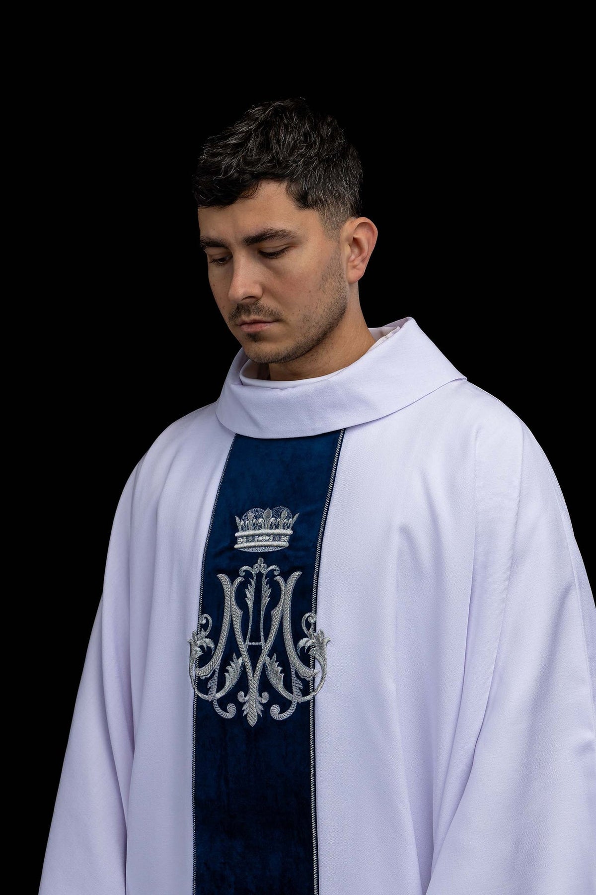 Side front view of the ecru Marian chasuble with silver embroidered monogram