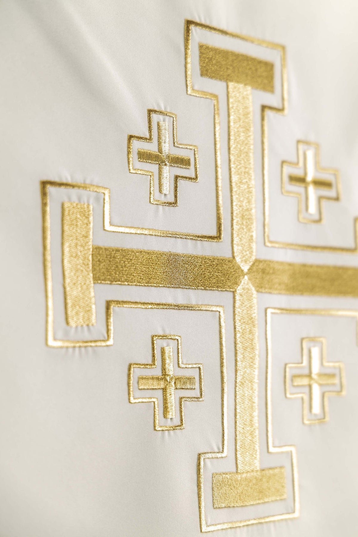 Side detail of the church lectern cover with gold Jerusalem cross embroidery