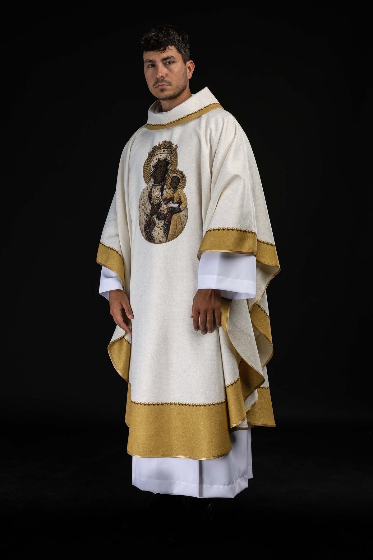 Three-quarter front view of the chasuble with Our Lady image and gold trim