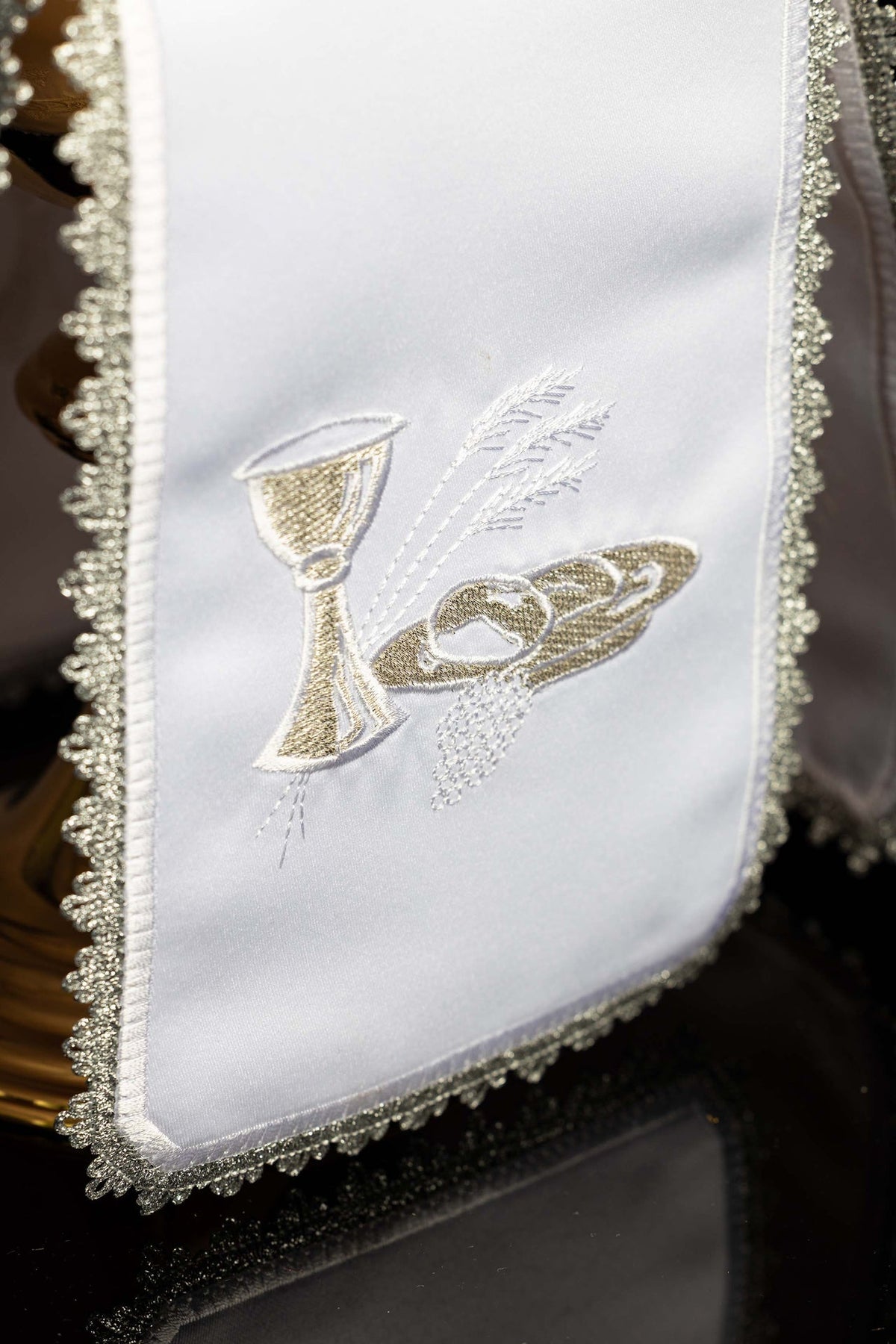 Close-up of the ciborium veil showing silver chalice, host and wheat embroidery
