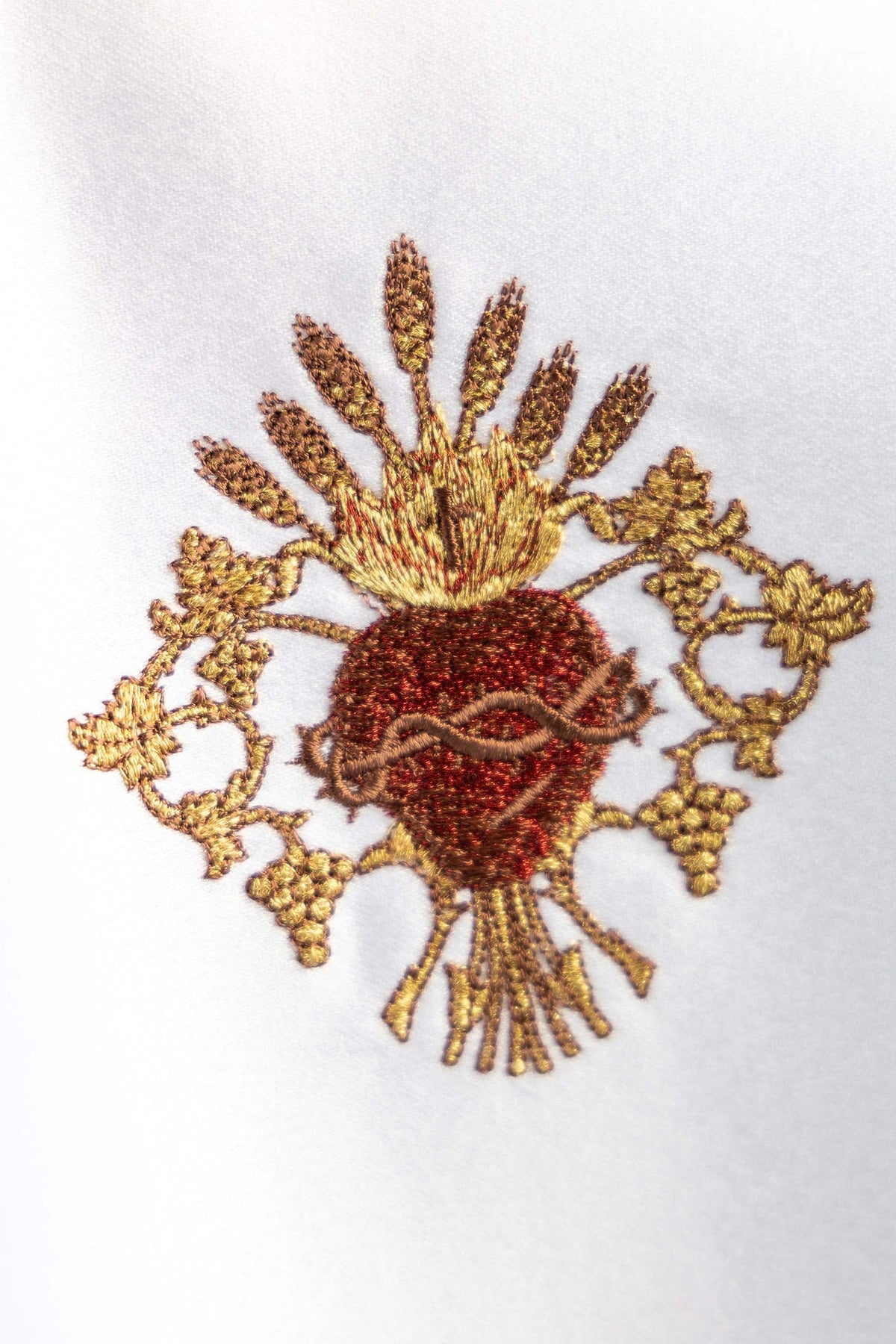 Close-up of Sacred Heart of Jesus embroidery on the white ciborium veil