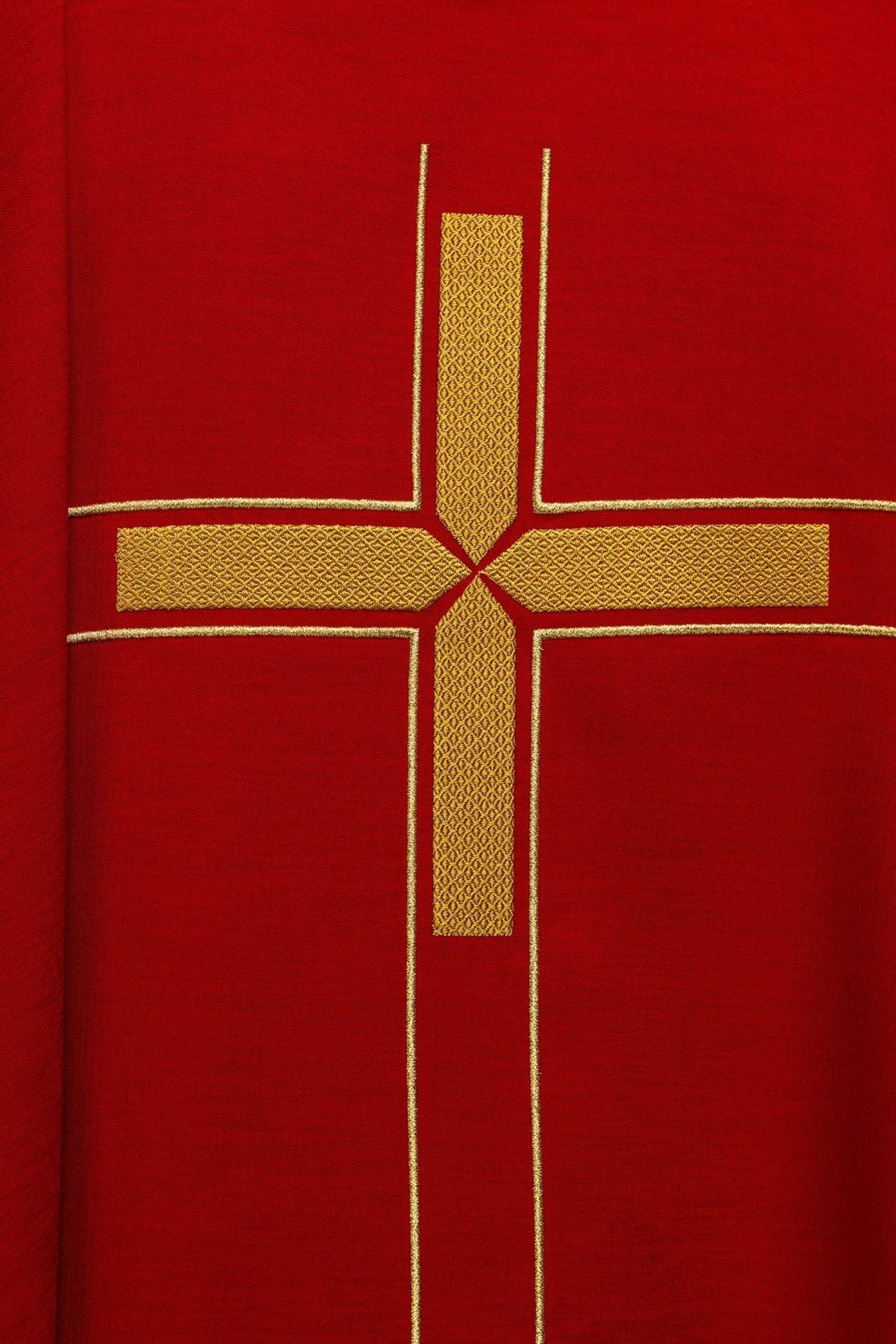 Close-up of the red chasuble showing gold cross embroidery