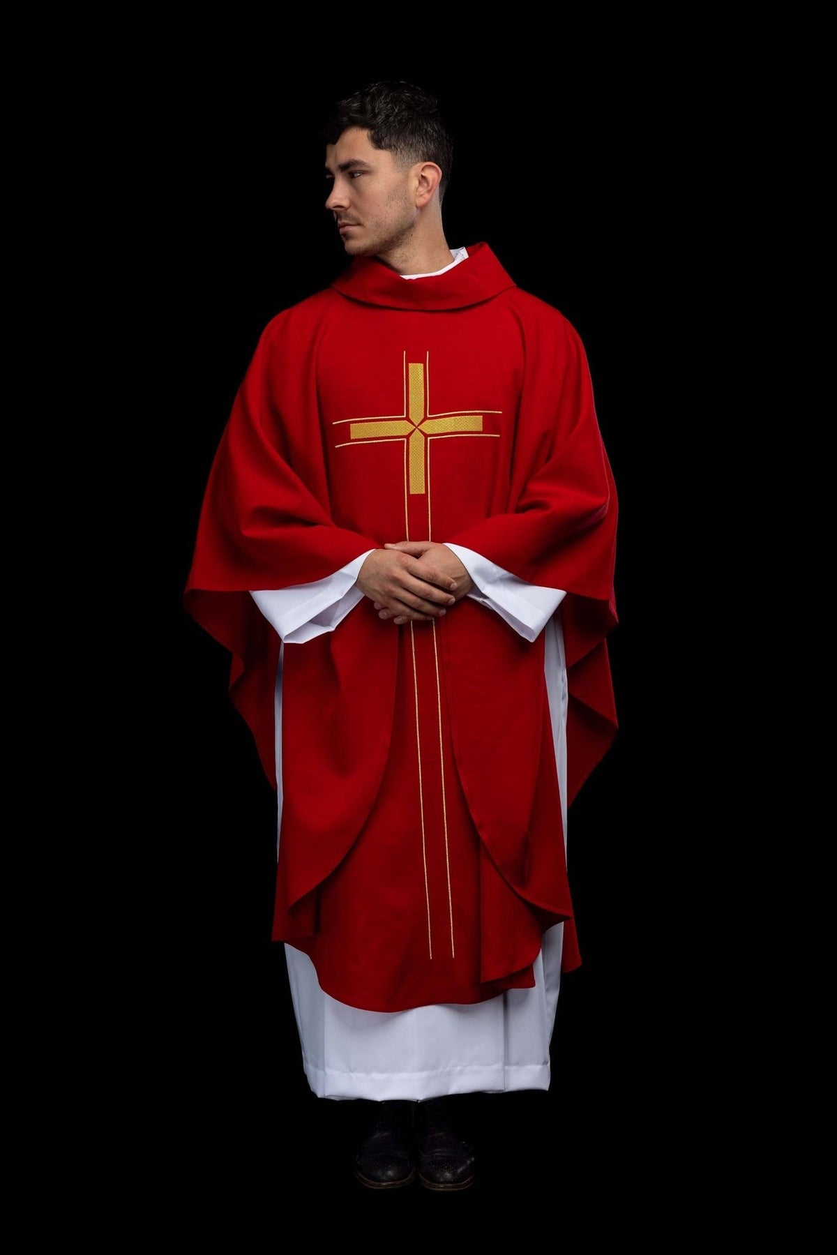Front full view of the red chasuble with gold cross embroidery