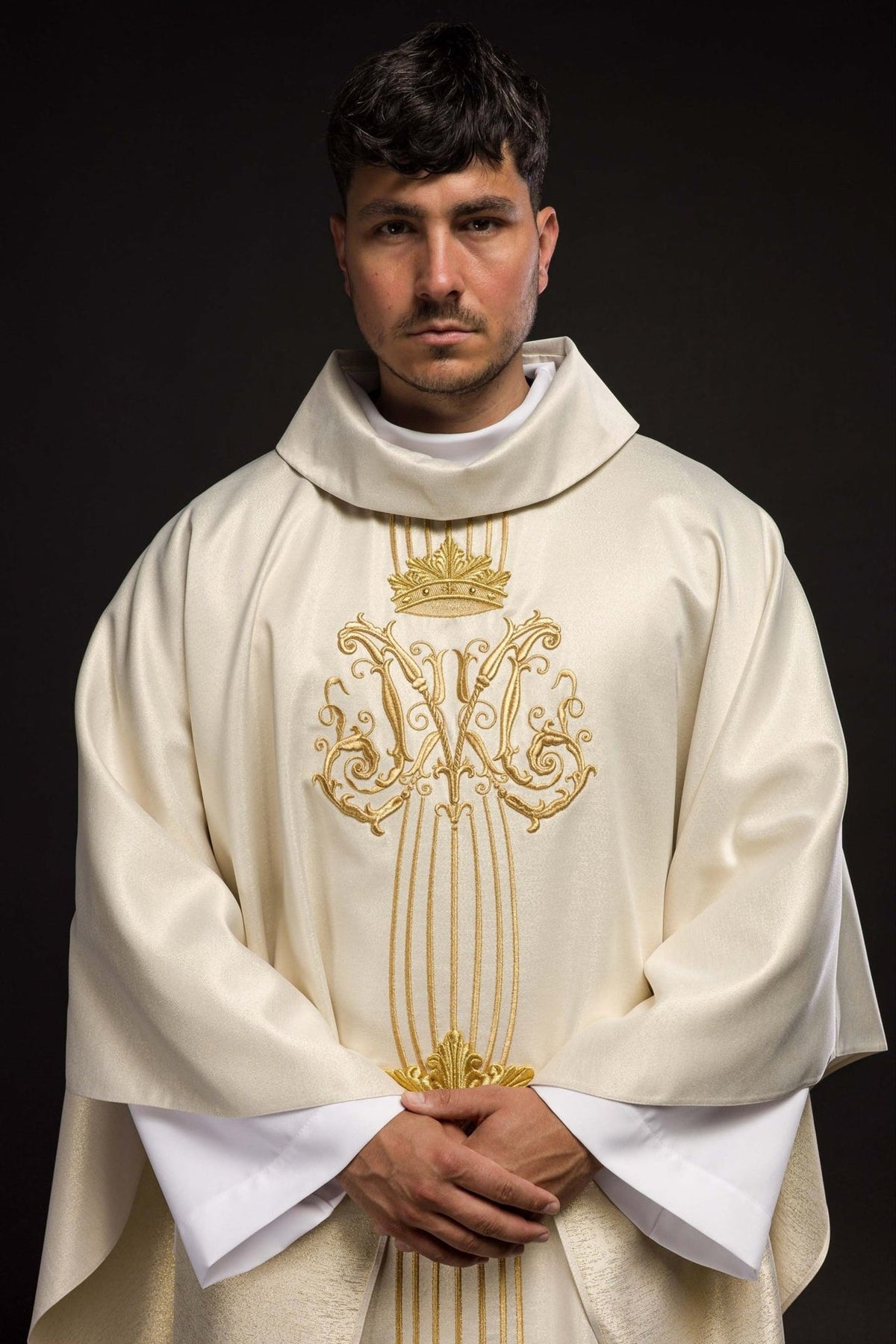 Front view of an Ecru Liturgical Chasuble Embroidered with a Gold Crown, worn