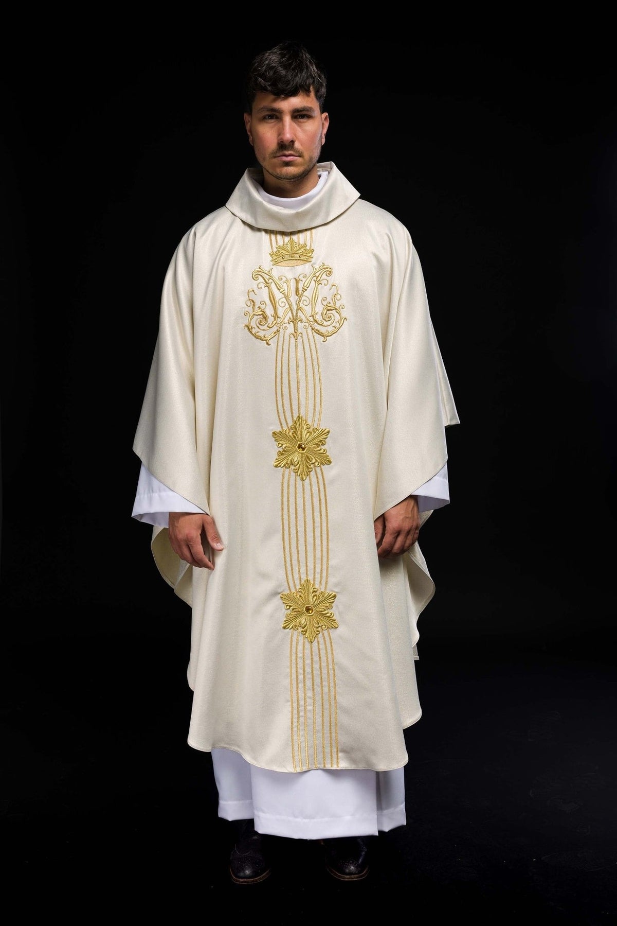 Full front view of the liturgical chasuble with gold crown and vertical embroidery