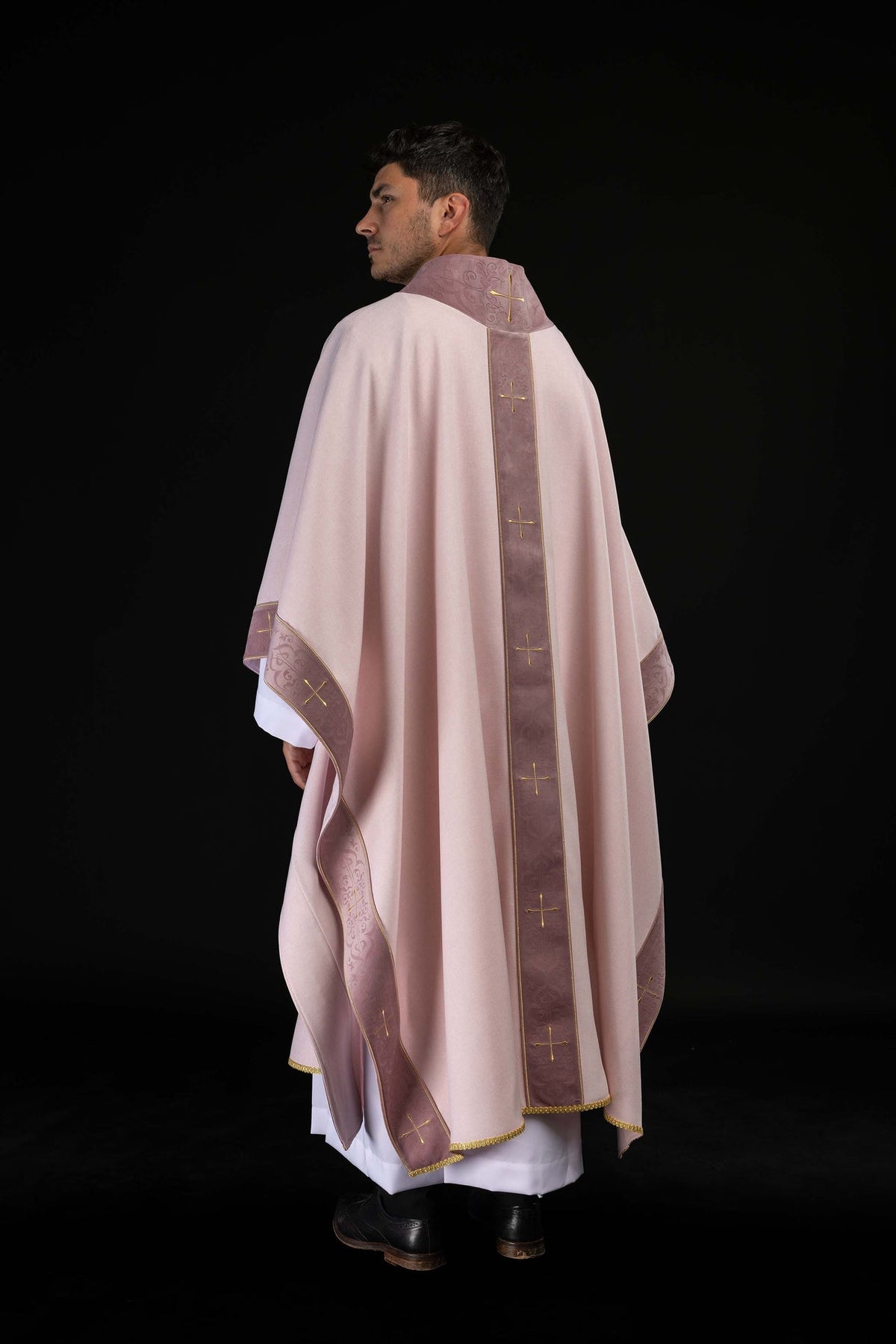 Front view of the rose chasuble showing the embroidered orphrey and gold crosses