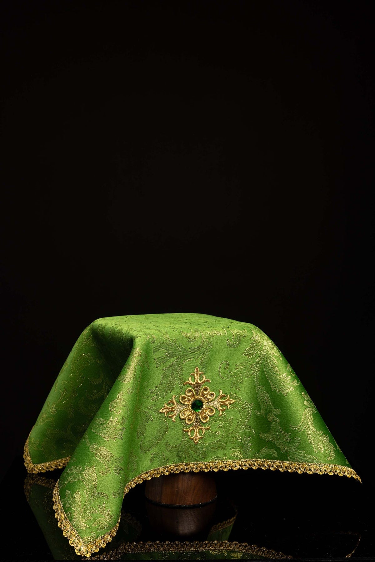 Front view of a Chalice Veil Embroidered with a Gold Cross and Green Decorative Stone in green with gold trim