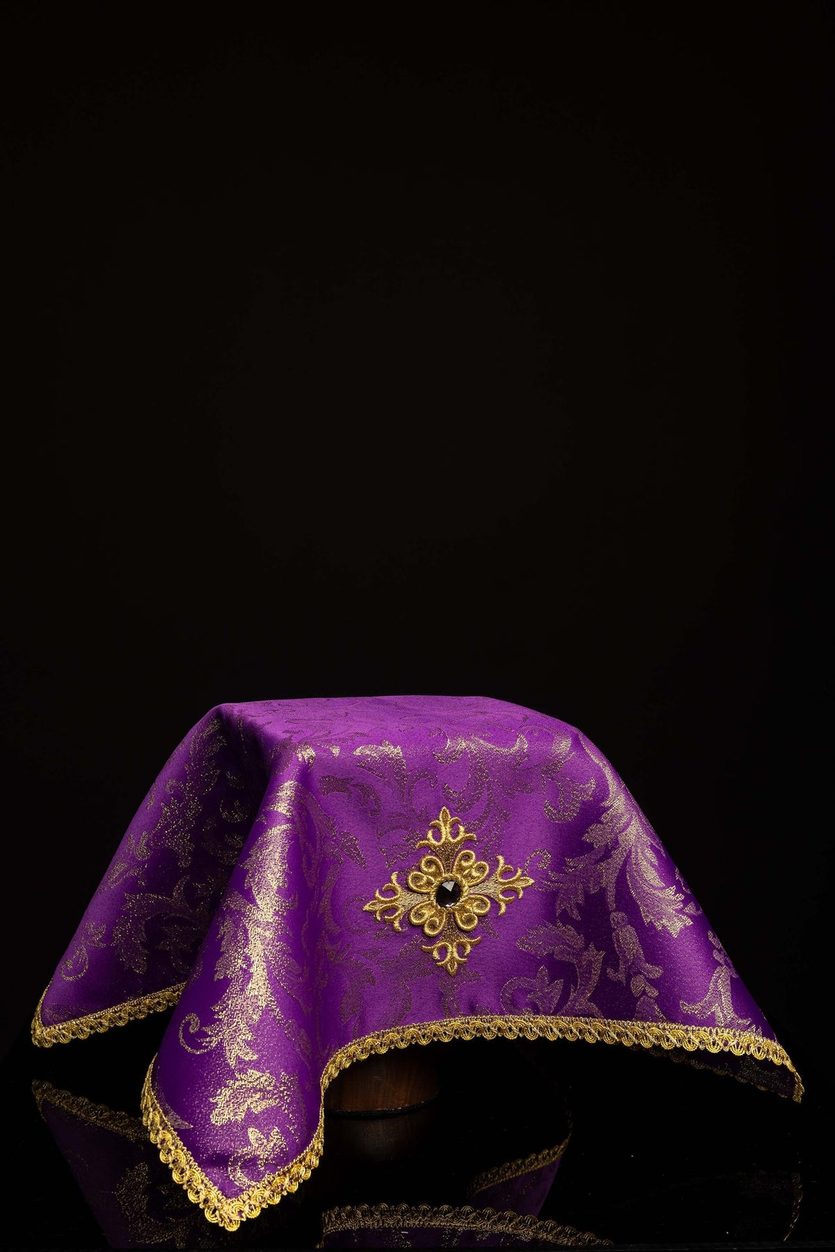 Front view of a Purple Chalice Veil Embroidered with a Gold Cross, ornate gold trim and patterned fabric