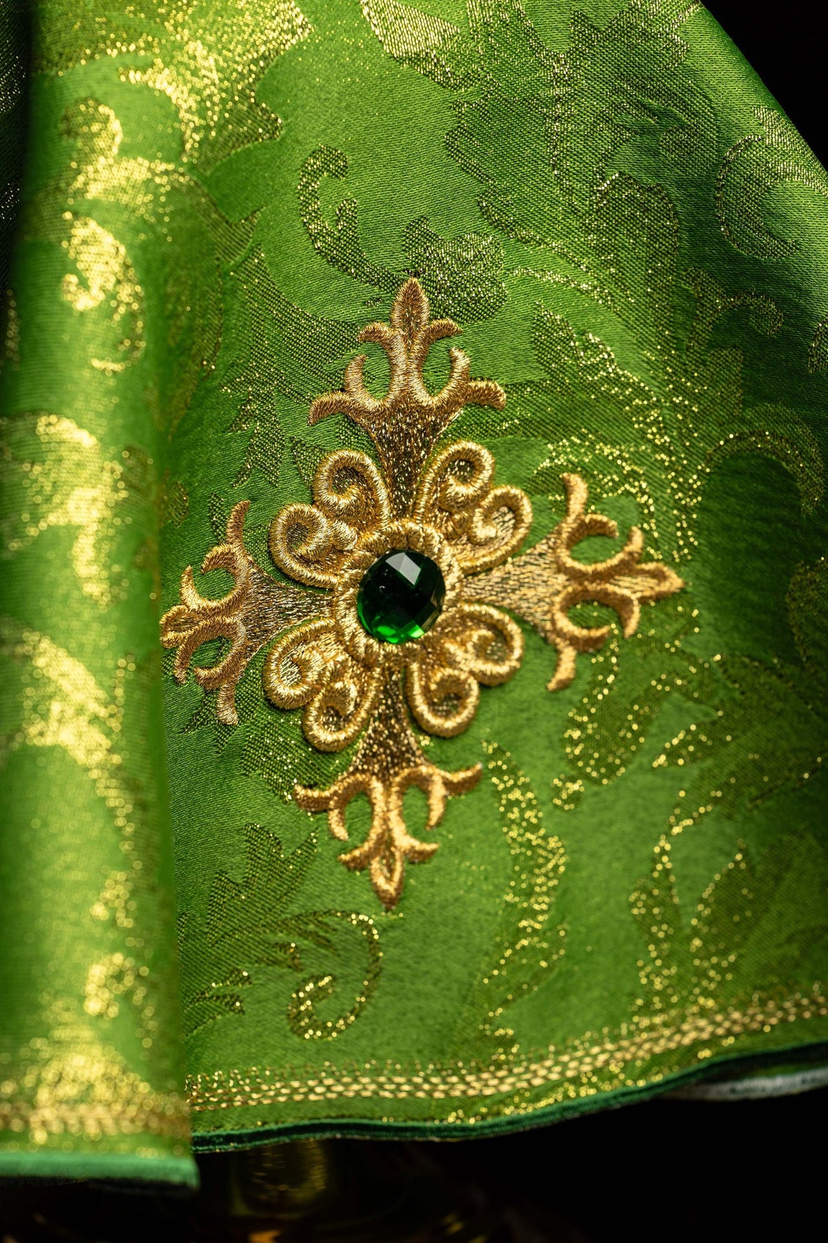 Close-up of the ciborium veil with embroidered cross and green stone