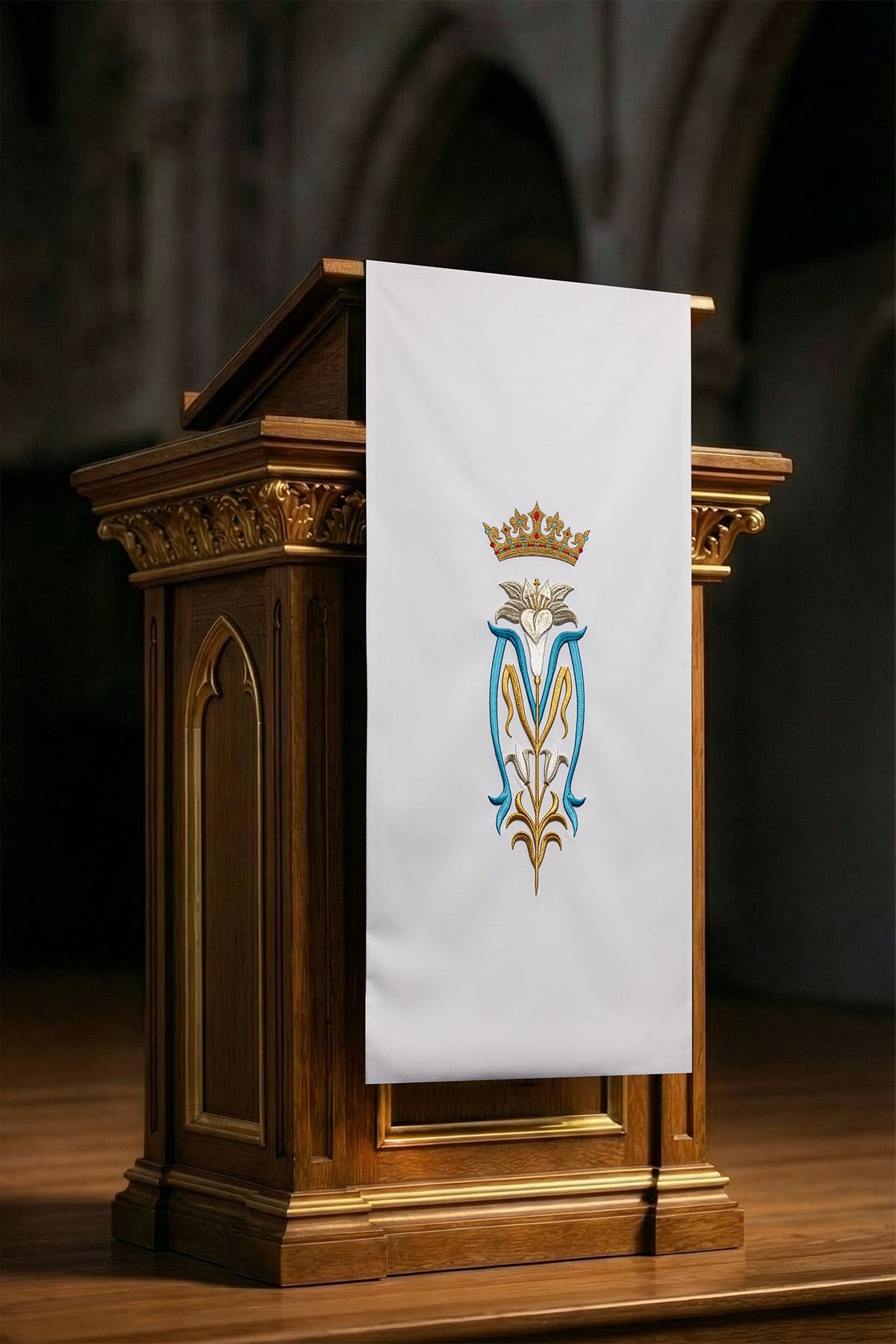 White lectern cover embroidered with a white Marian motif