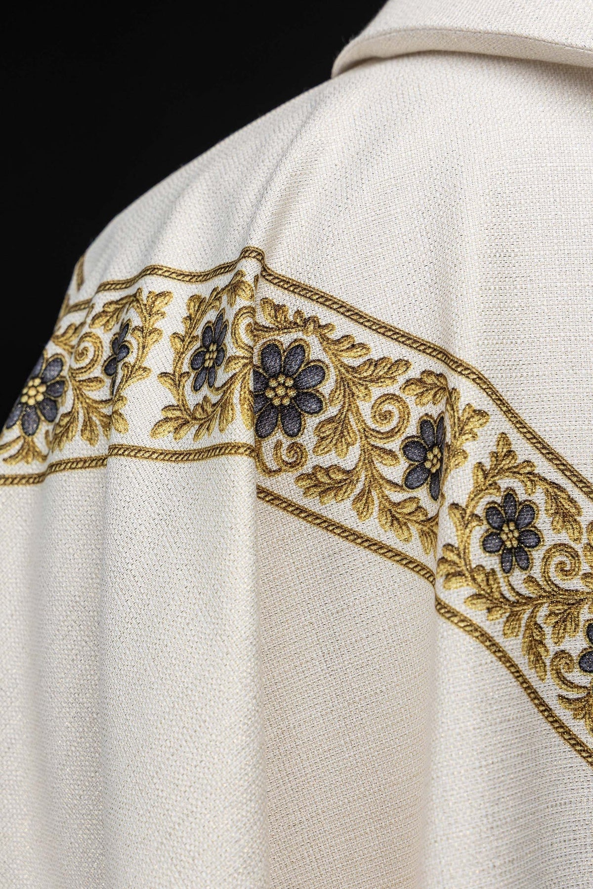 Close-up of the chasuble's blue and gold floral back band